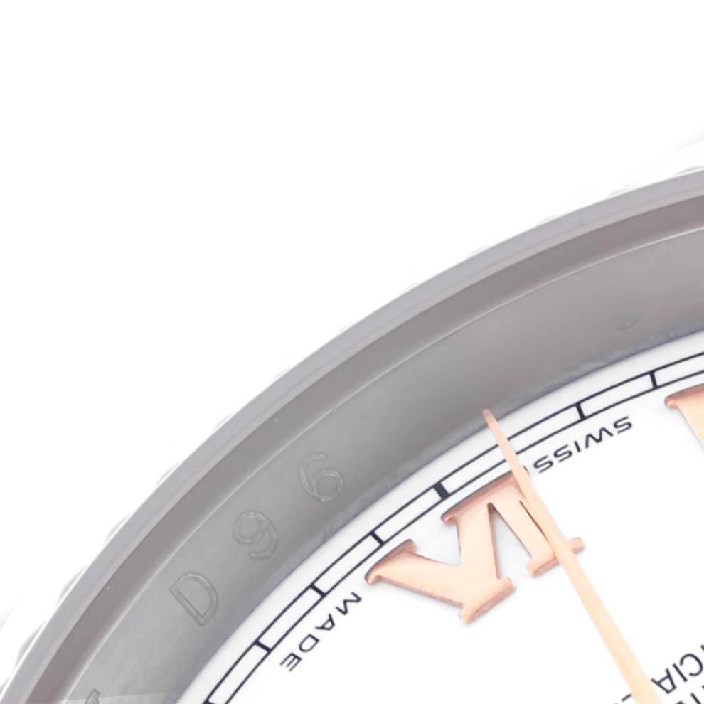 The image shows a close-up of the dial and part of the bezel of a Rolex Datejust 116231 Men's Steel and Gold (two tone) White Dial 116231 Men's Steel and Gold (two tone) White Dial watch, highlighting the Roman numeral "VI".