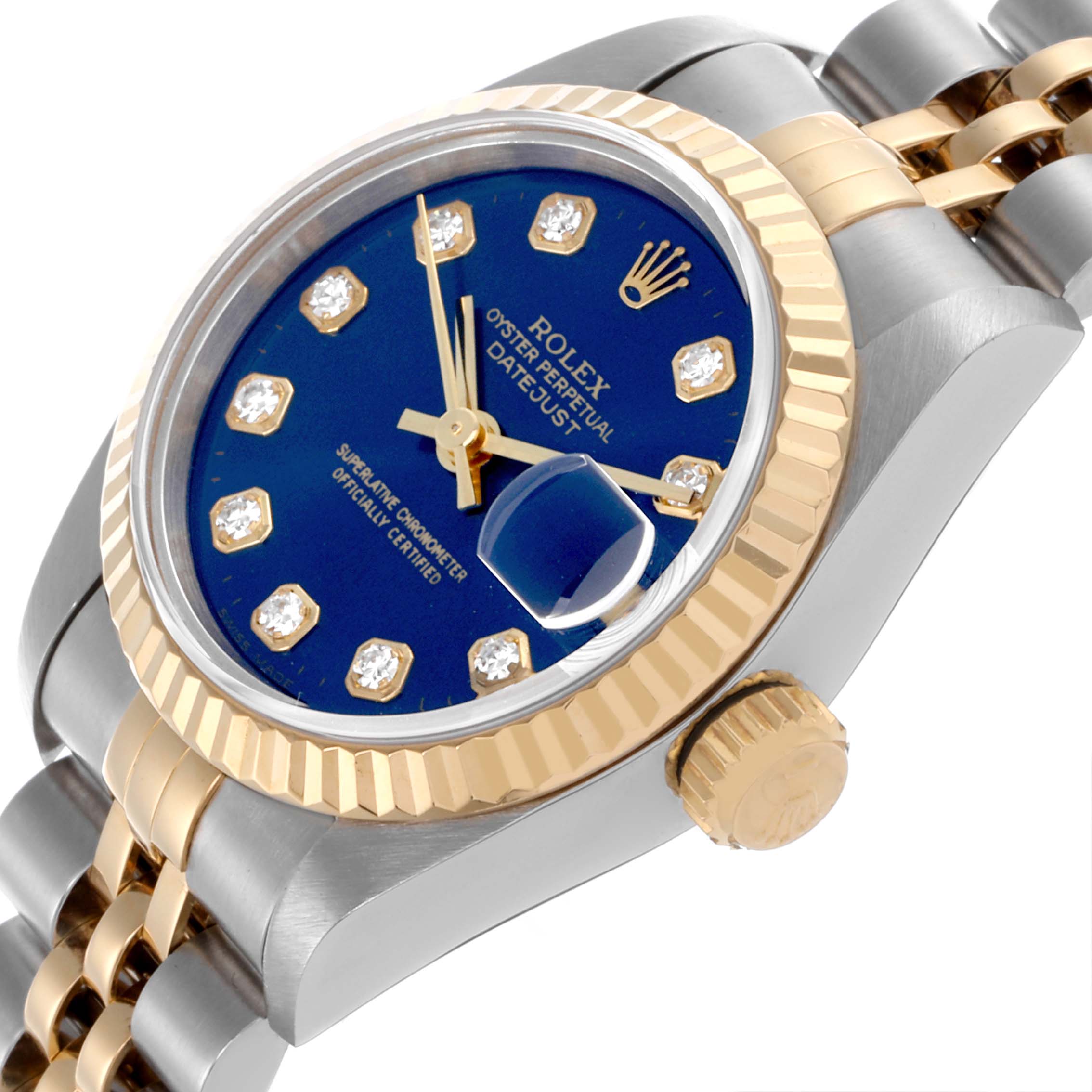 The Rolex Datejust 69173 Women's Steel and Gold (two tone) Blue Dial 69173 Women's Steel and Gold (two tone) Blue Dial watch is shown at a tilted angle, highlighting the blue dial, fluted bezel, diamond markers, and two-tone bracelet.