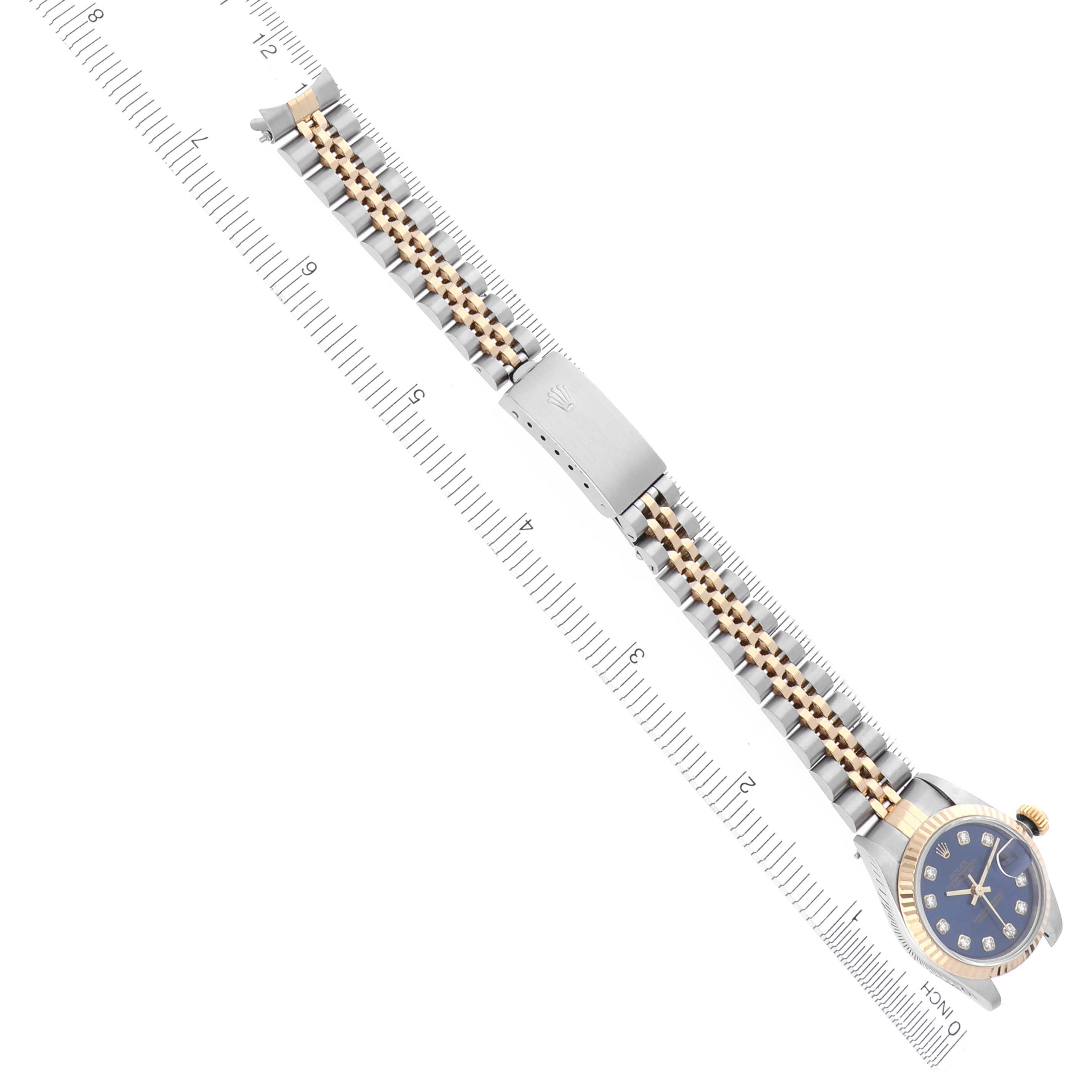 The image shows a Rolex Datejust 69173 Women's Steel and Gold (two tone) Blue Dial 69173 Women's Steel and Gold (two tone) Blue Dial watch from a top angle, highlighting the bracelet and clasp alongside a ruler for scale.