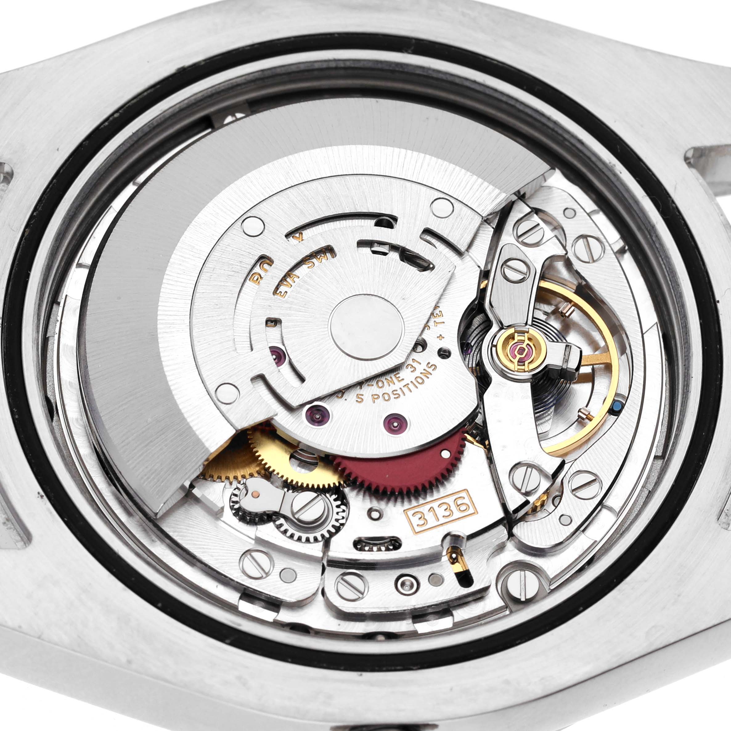 The image shows the movement of the Rolex Datejust 41 116300 Men's Stainless Steel Silver Dial 116300 Men's Stainless Steel Silver Dial, focusing on its intricate gears and components from a back angle.