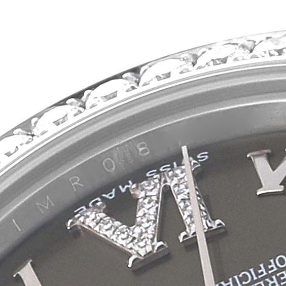 This image shows a close-up of the bezel and part of the dial with diamond Roman numerals on the Rolex Mid-Size 178384 Women's Stainless Steel Brown Dial 178384 Women's Stainless Steel Brown Dial model watch.