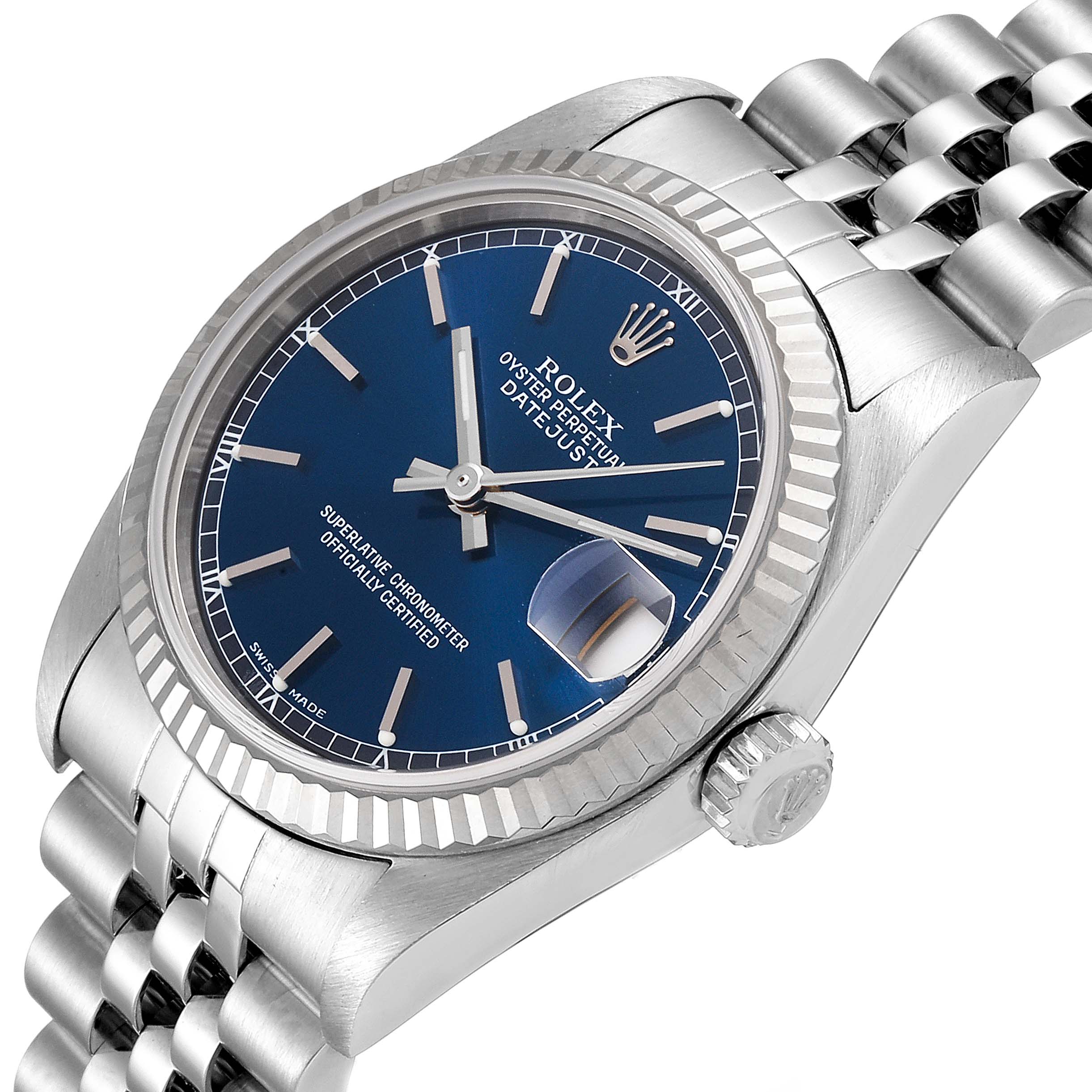 This image shows a Rolex Mid-Size 78274 Women's Stainless Steel Blue Dial 78274 Women's Stainless Steel Blue Dial Datejust watch from an angled perspective highlighting the blue dial, bezel, crown, and part of the bracelet.
