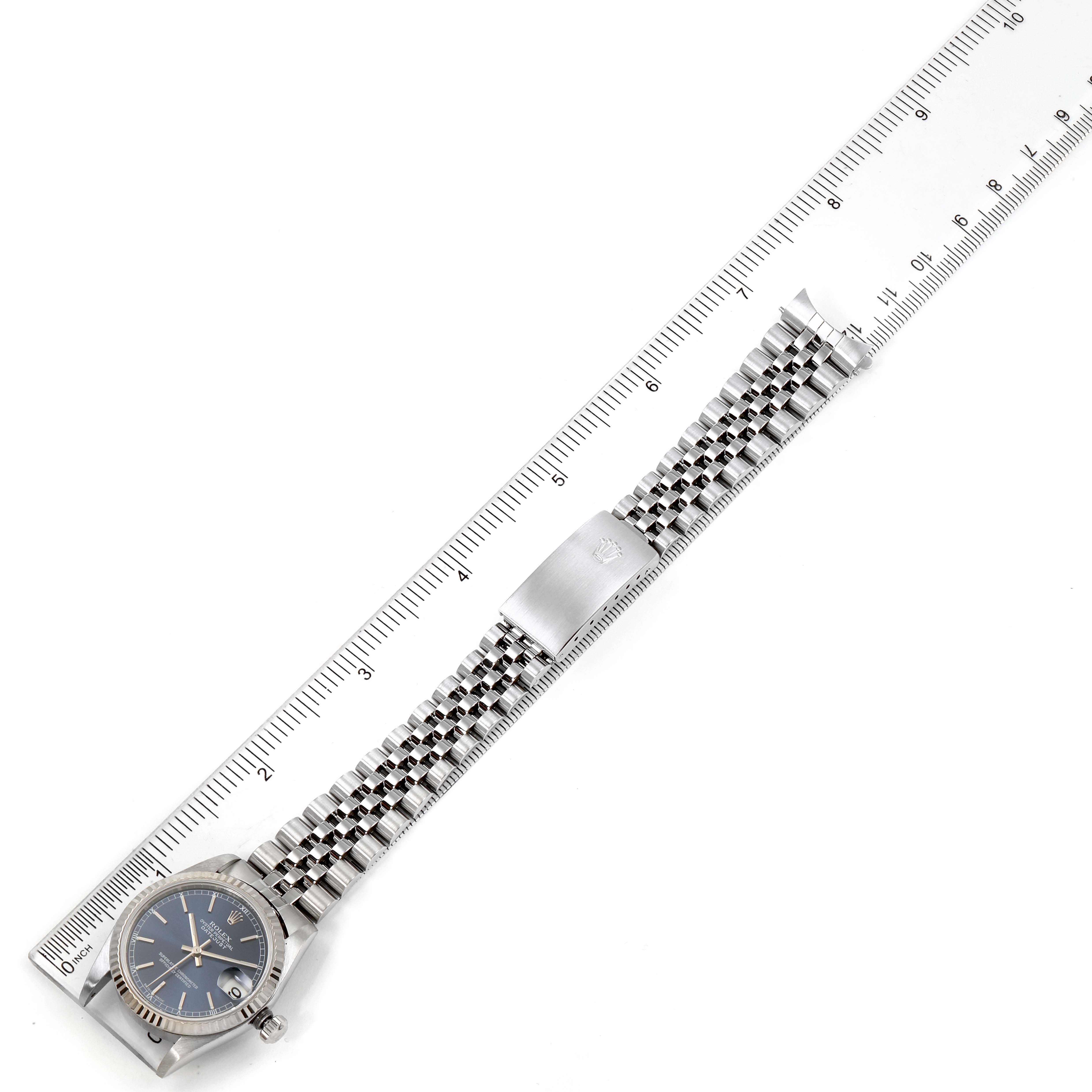 The image shows a laid-flat Rolex Mid-Size 78274 Women's Stainless Steel Blue Dial 78274 Women's Stainless Steel Blue Dial watch with a ruler, displaying the full bracelet and face from an overhead angle.