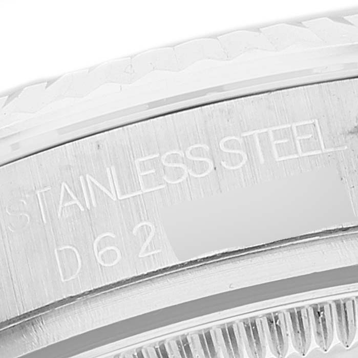 The image shows a close-up of the engraved side of a Rolex Mid-Size 178274 Women's Stainless Steel Mother of Pearl Dial 178274 Women's Stainless Steel Mother of Pearl Dial stainless steel watch case.