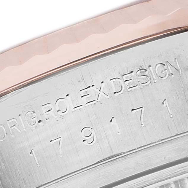 The image shows a close-up of the case side engraving on a Rolex Datejust 179171 Women's Steel and Gold (two tone) Black Dial, featuring the text "ORIG. ROLEX DESIGN" and a serial number.