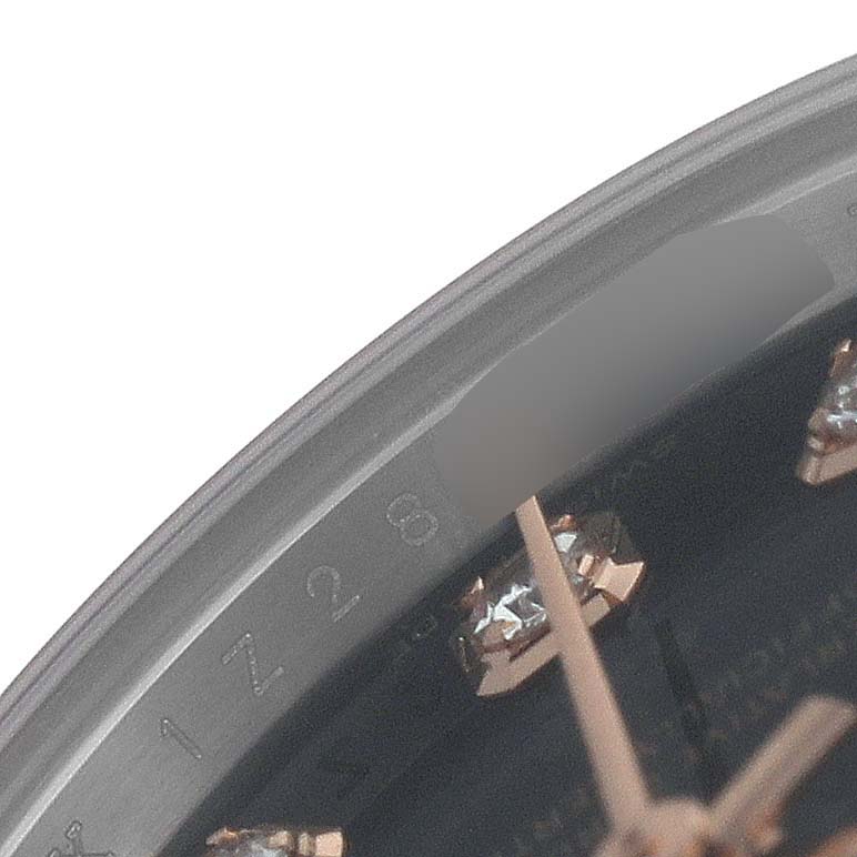 The image shows a close-up of a Rolex Datejust 179171 Women's Steel and Gold (two tone) Black Dial watch dial, featuring part of the hands and diamond hour markers.