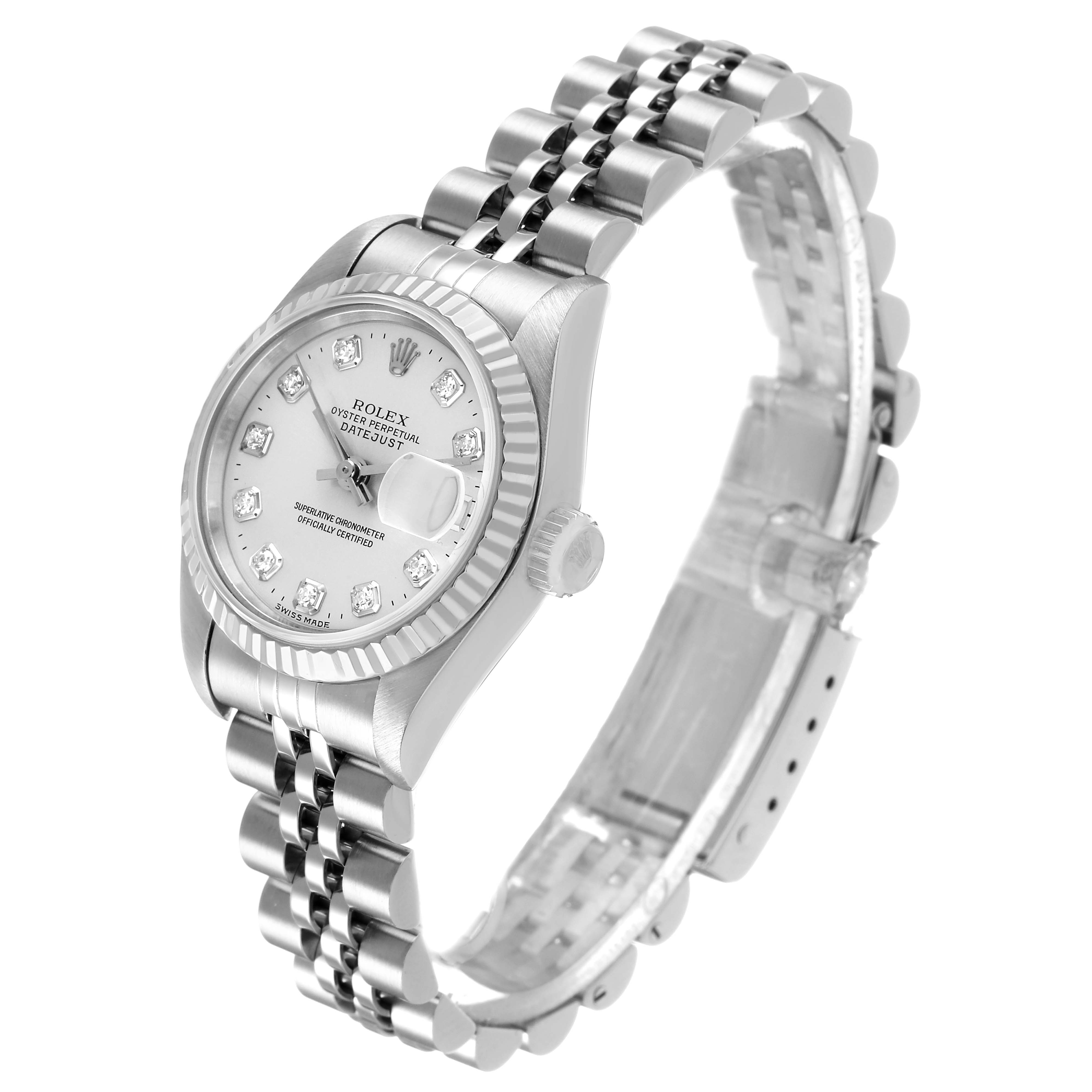 The Rolex Datejust 69174 Women's Stainless Steel Silver Dial watch is shown at an angled side view, highlighting its face, fluted bezel, and jubilee bracelet.