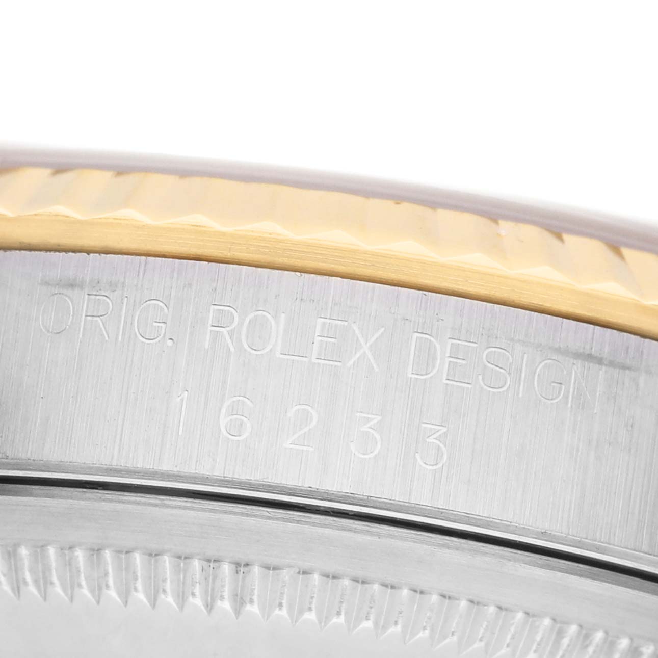 The image shows a close-up of the Rolex Datejust 16233 Men's Stainless Steel Champagne Dial model's case, highlighting the "ORIG. ROLEX DESIGN" engraving.
