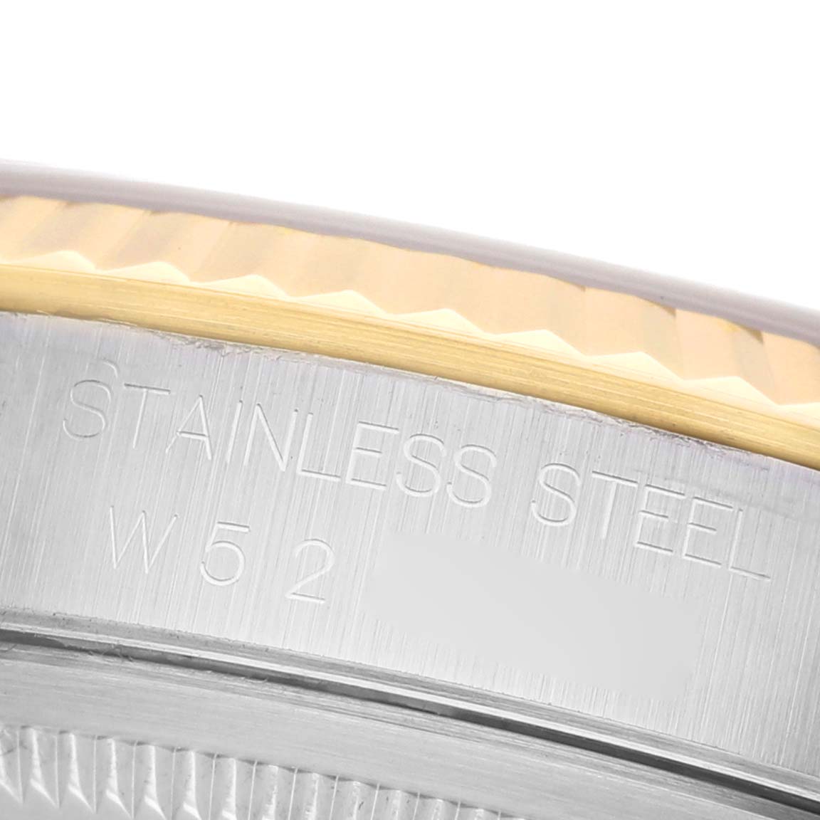 The image shows a close-up of the stainless steel and gold bezel with engraving on the Rolex Datejust 16233 Men's Stainless Steel Champagne Dial model.