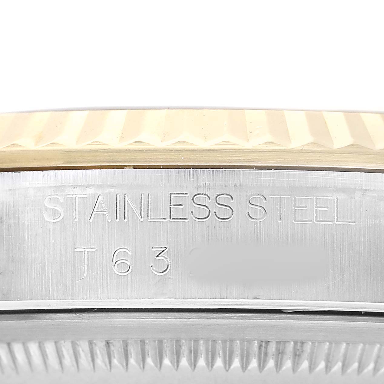 The image shows a side view of a Rolex Datejust 16233 Men's Steel and Gold (two tone) Champagne Dial watch, focusing on the stainless steel casing and fluted bezel.