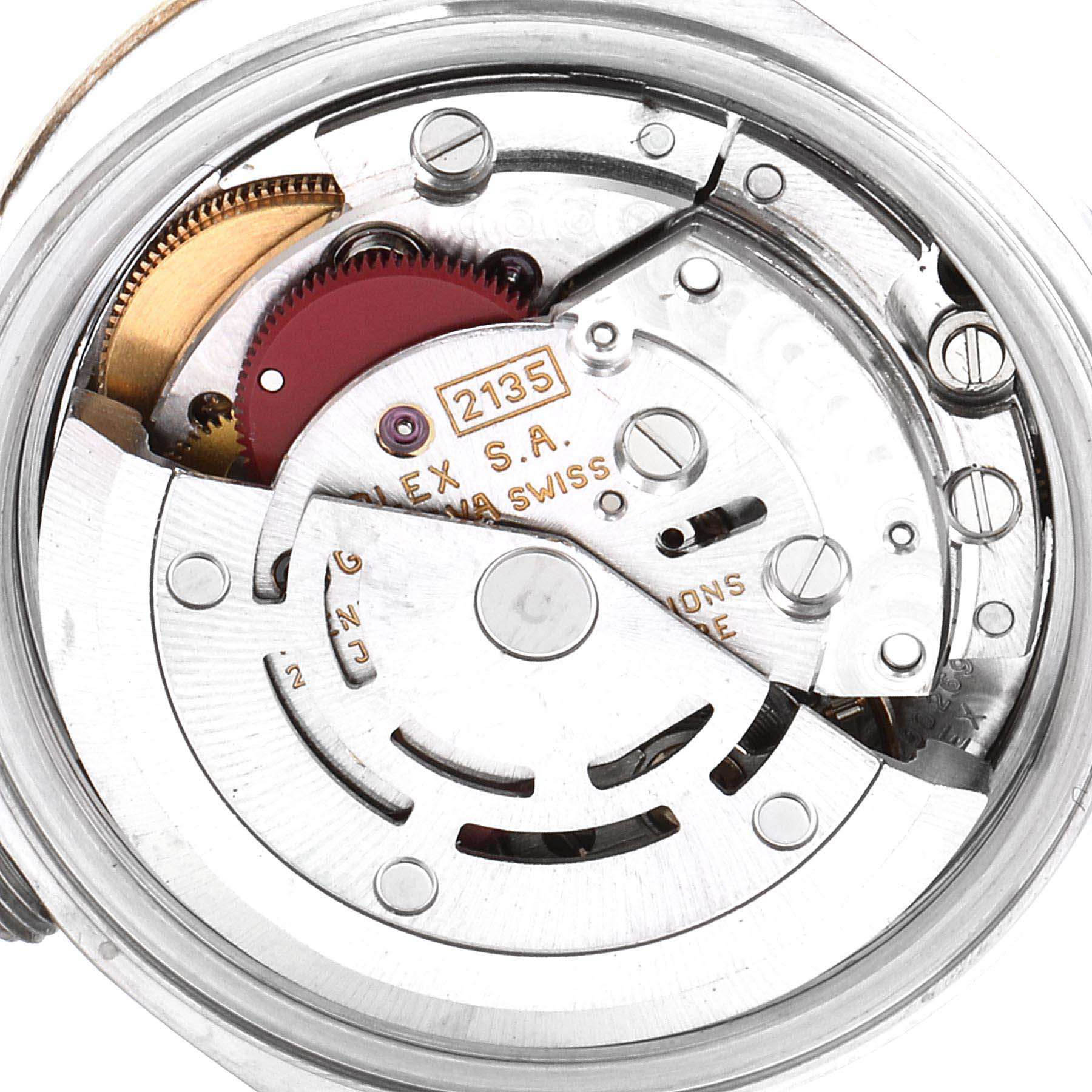 Close-up view of the movement (caliber 2135) of a Rolex Datejust 69173 Women's Steel and Gold (two tone) White Dial 69173 Women's Steel and Gold (two tone) White Dial watch, showing intricate gears and components.