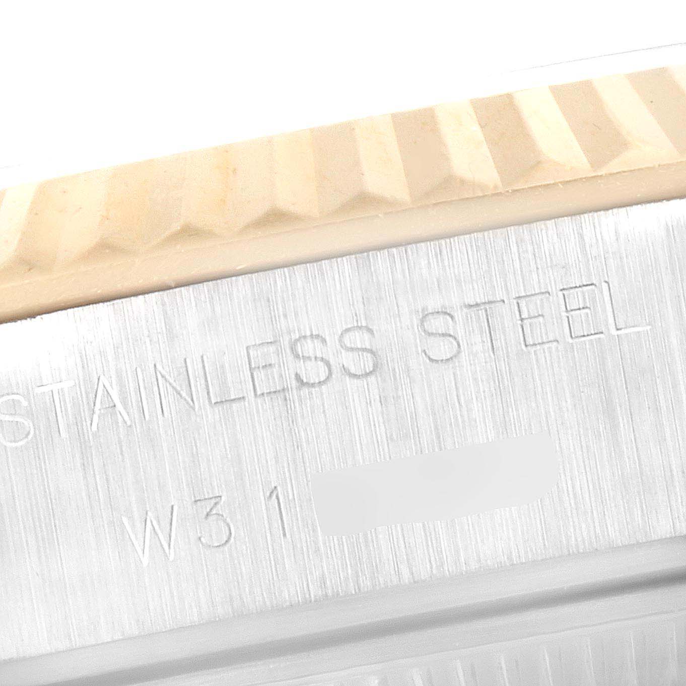 This close-up image shows the fluted bezel and the stainless steel case of a Rolex Datejust 69173 Women's Steel and Gold (two tone) White Dial 69173 Women's Steel and Gold (two tone) White Dial watch.