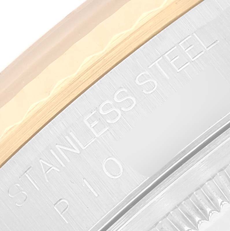 This close-up image of a Rolex Datejust 16233 Men's Steel and Gold (two tone) Mother of Pearl Dial 16233 Men's Steel and Gold (two tone) Mother of Pearl Dial shows the stainless steel and gold bezel with some engraved text.