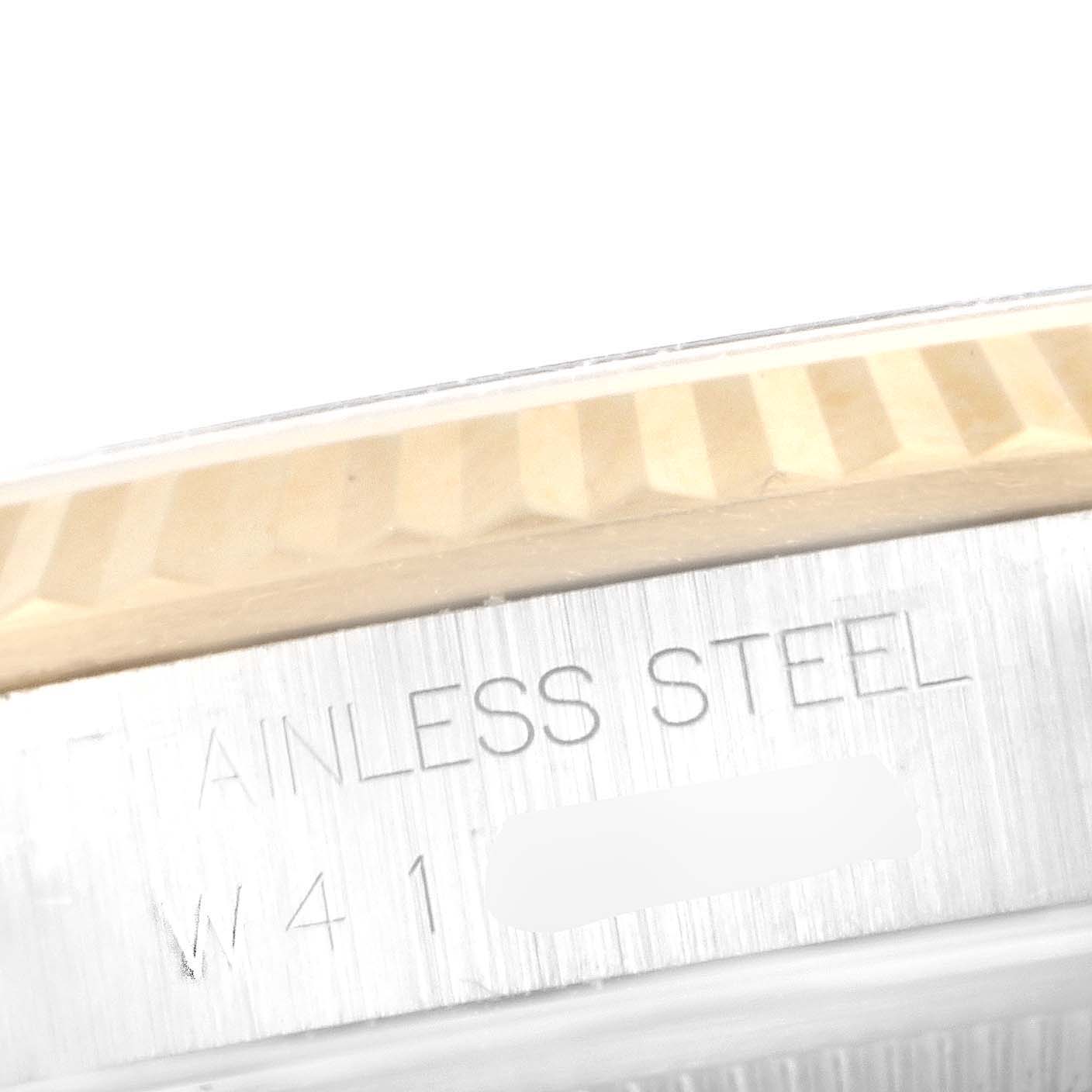 The image shows a close-up of the bezel and case edge of a Rolex Datejust 16233 Men's Steel and Gold (two tone) Blue Dial 16233 Men's Steel and Gold (two tone) Blue Dial watch, highlighting the "STAINLESS STEEL" engraving.