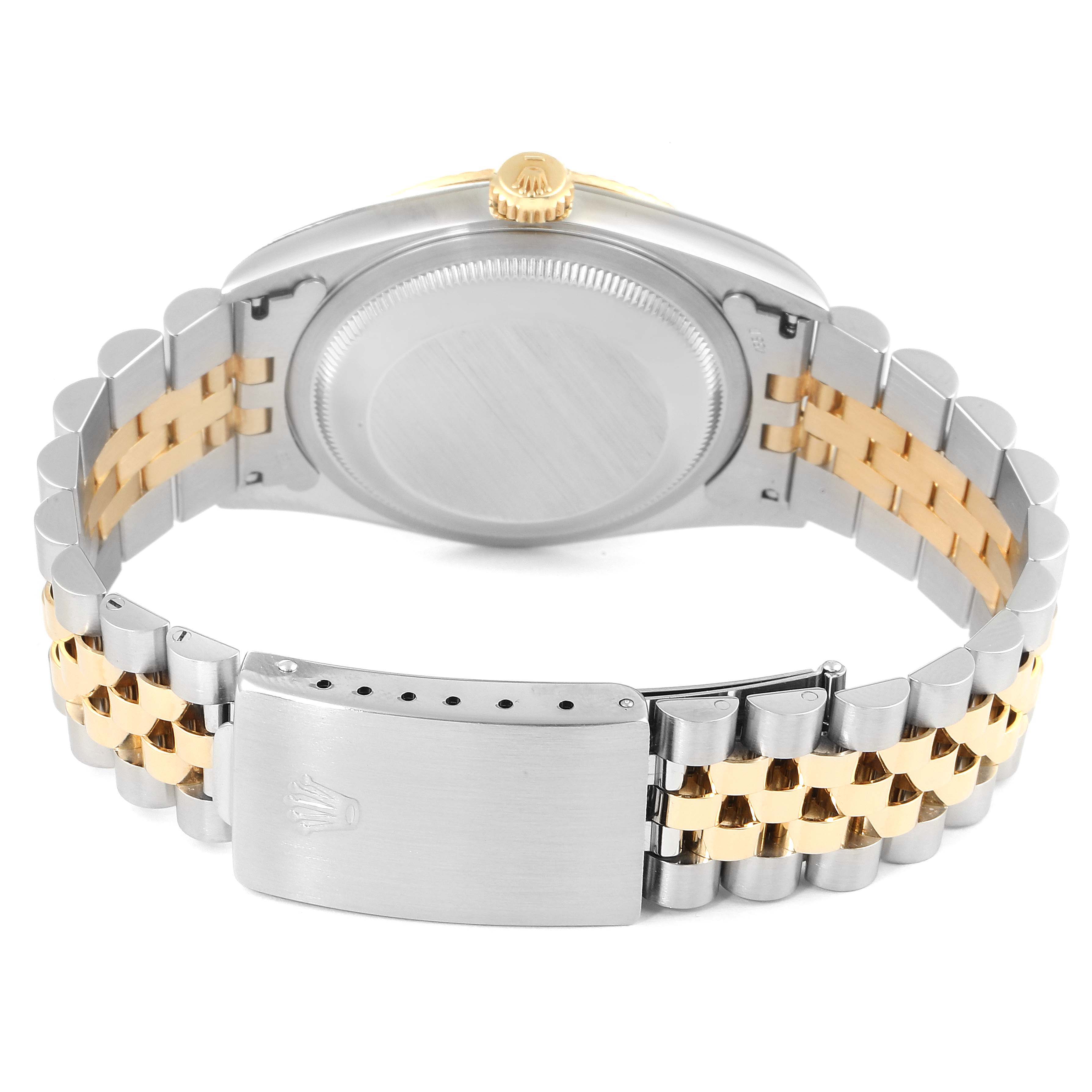 The image shows the back case and bracelet of a Rolex Datejust 16233 Men's Steel and Gold (two tone) Blue Dial 16233 Men's Steel and Gold (two tone) Blue Dial watch, with a two-tone metal design and clasp.