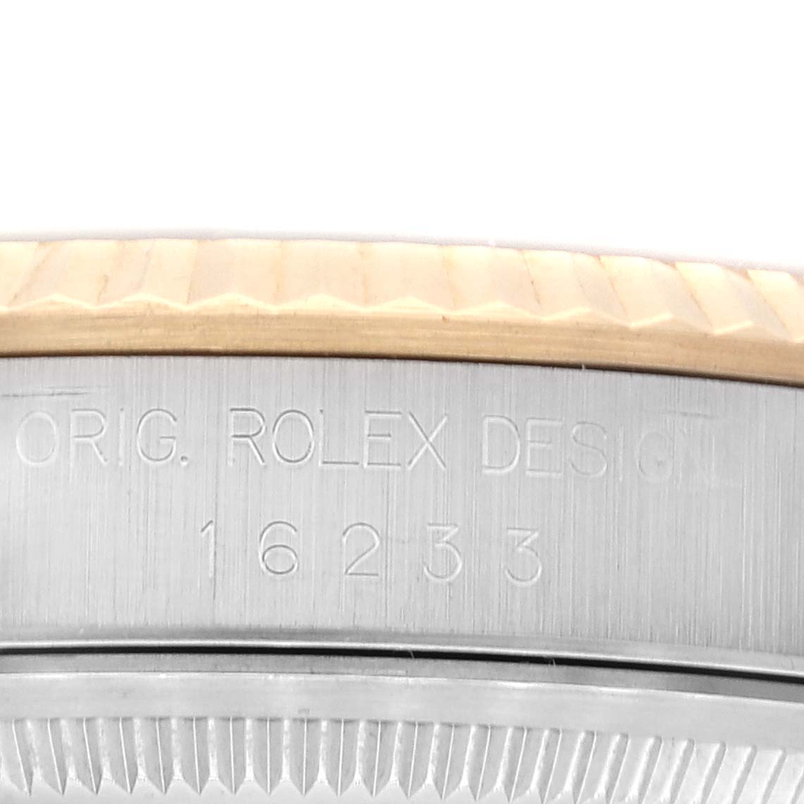This is a close-up shot showing the bezel and case engraving details of the Rolex Datejust 16233 Men's Steel and Gold (two tone) Purple Dial 16233 Men's Steel and Gold (two tone) Purple Dial model 16233.