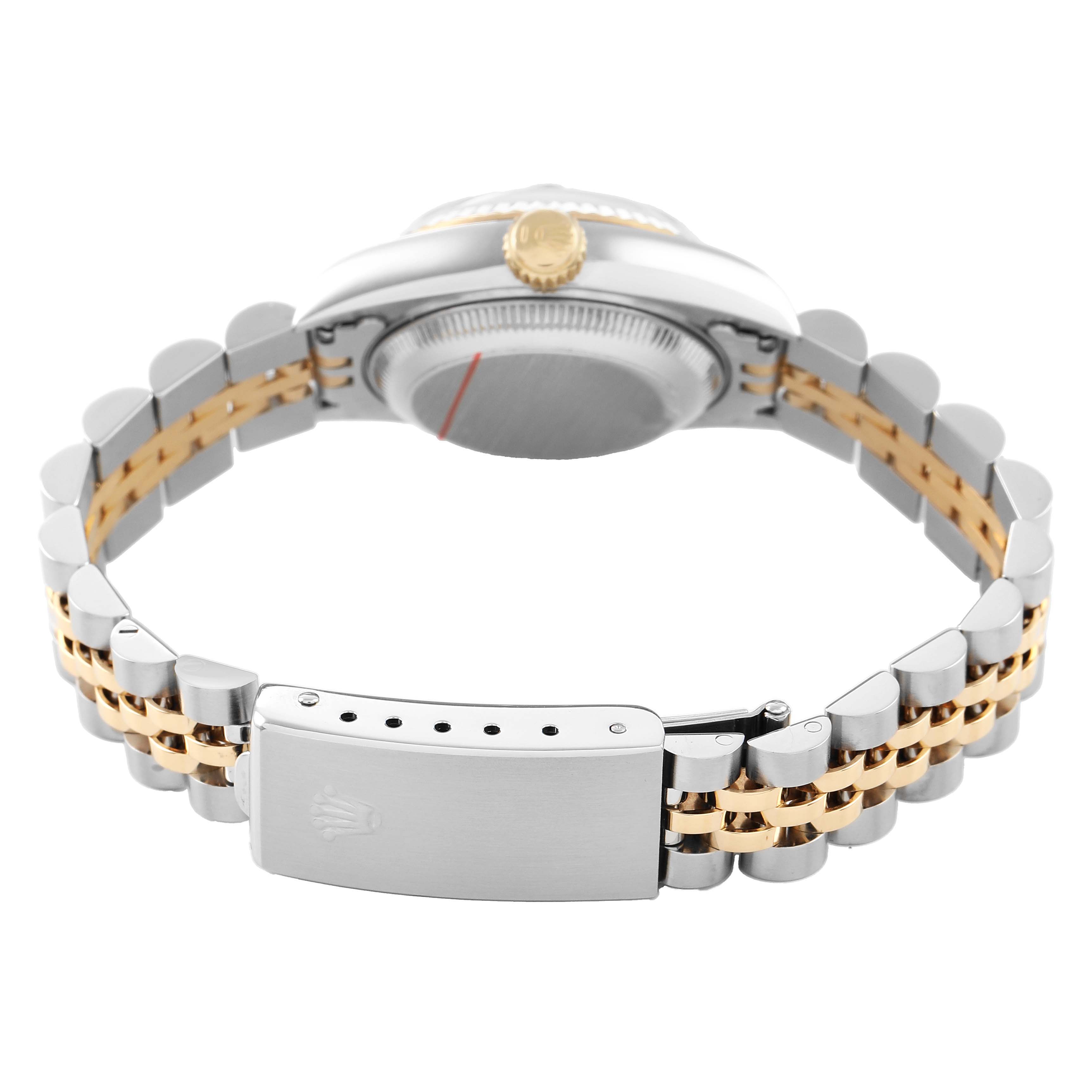 The Rolex Datejust 69173 Women's Steel and Gold (two tone) White Dial is shown from the case back angle, featuring the clasp and bracelet with a two-tone design.