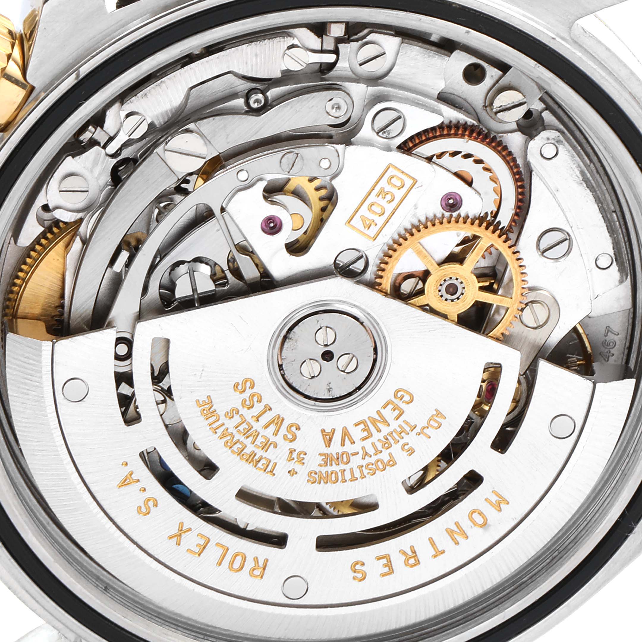 The image shows the internal mechanics of a Rolex Daytona 16523 Men's Steel and Gold (two tone) White Dial 16523 Men's Steel and Gold (two tone) White Dial watch, focusing on the intricate movement components from a back angle.