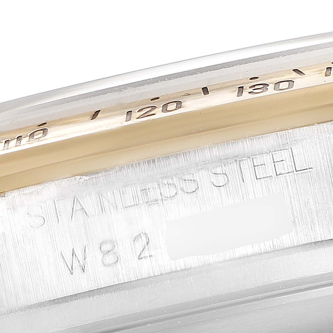 The image shows the side profile of the Rolex Daytona 16523 Men's Steel and Gold (two tone) White Dial 16523 Men's Steel and Gold (two tone) White Dial watch, highlighting the stainless steel casing and part of the bezel.