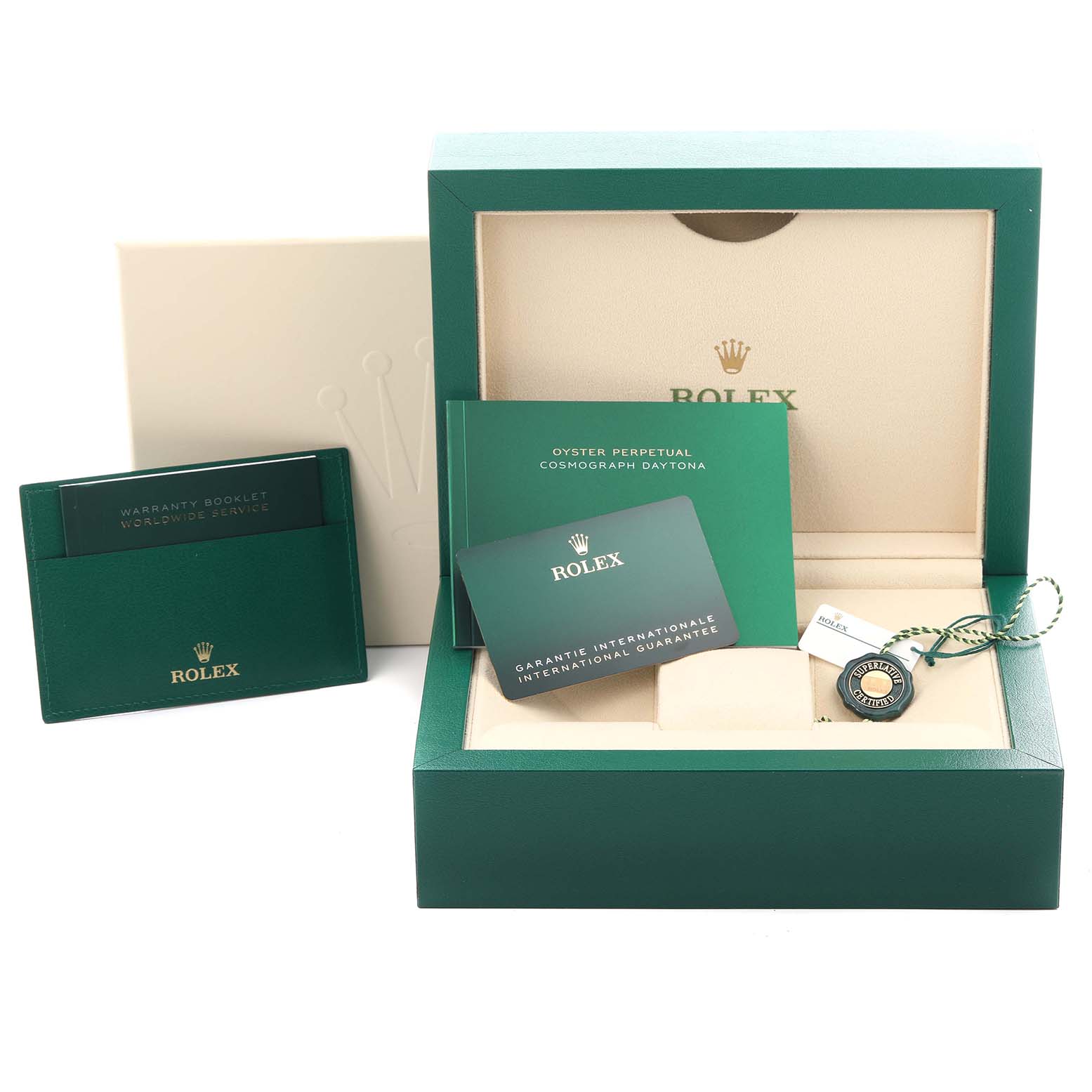 The image shows a Rolex Daytona 116518LN Men's Yellow Gold Champagne Dial 116518LN Men's Yellow Gold Champagne Dial box with booklets and a guarantee card placed at an angle, along with a tag.