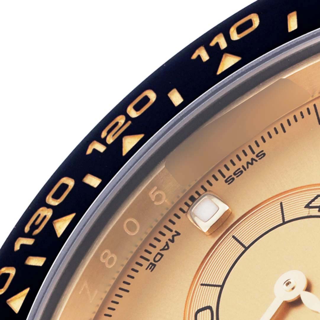 The image shows a close-up of the bezel and partial dial of the Rolex Daytona 116518LN Men's Yellow Gold Champagne Dial 116518LN Men's Yellow Gold Champagne Dial, highlighting the tachymetric scale.