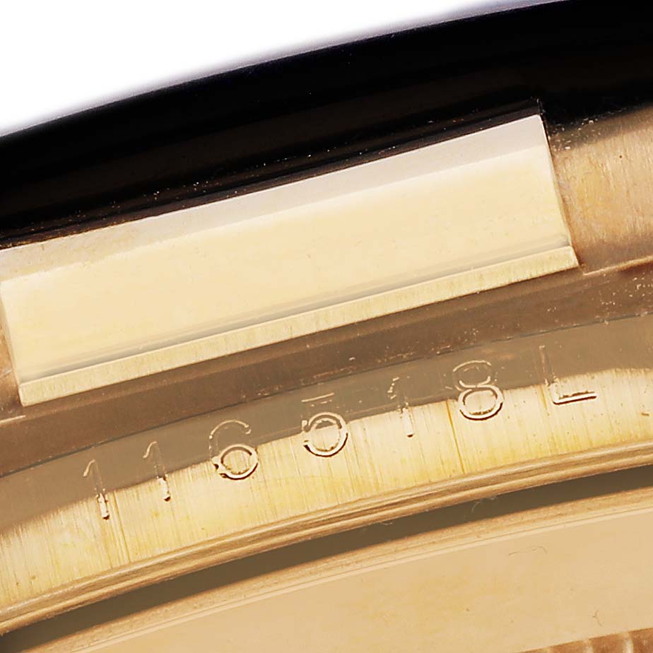 The image shows a close-up of the serial number engraving on the inner case rim of a Rolex Daytona 116518LN Men's Yellow Gold Champagne Dial 116518LN Men's Yellow Gold Champagne Dial watch.