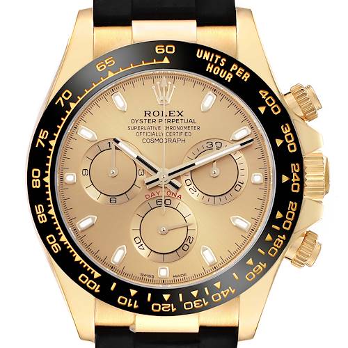 The Rolex Daytona watch is shown from a front angle, highlighting its gold dial, black bezel, pushers, and crown.