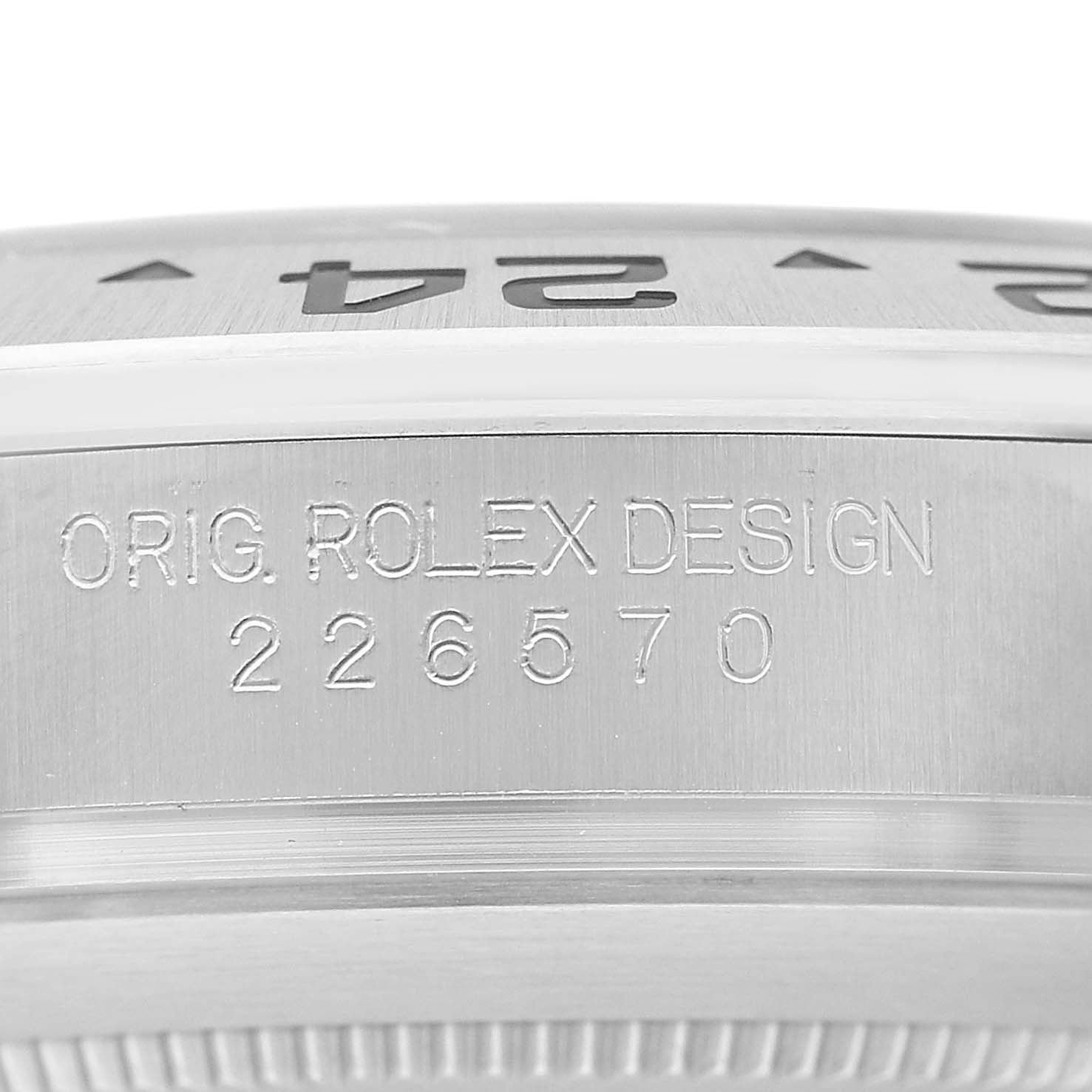 The image shows a close-up of the side of a Rolex Explorer 226570 Men's Stainless Steel White Dial watch, highlighting the engraved model number "226570" and "Orig. Rolex Design."