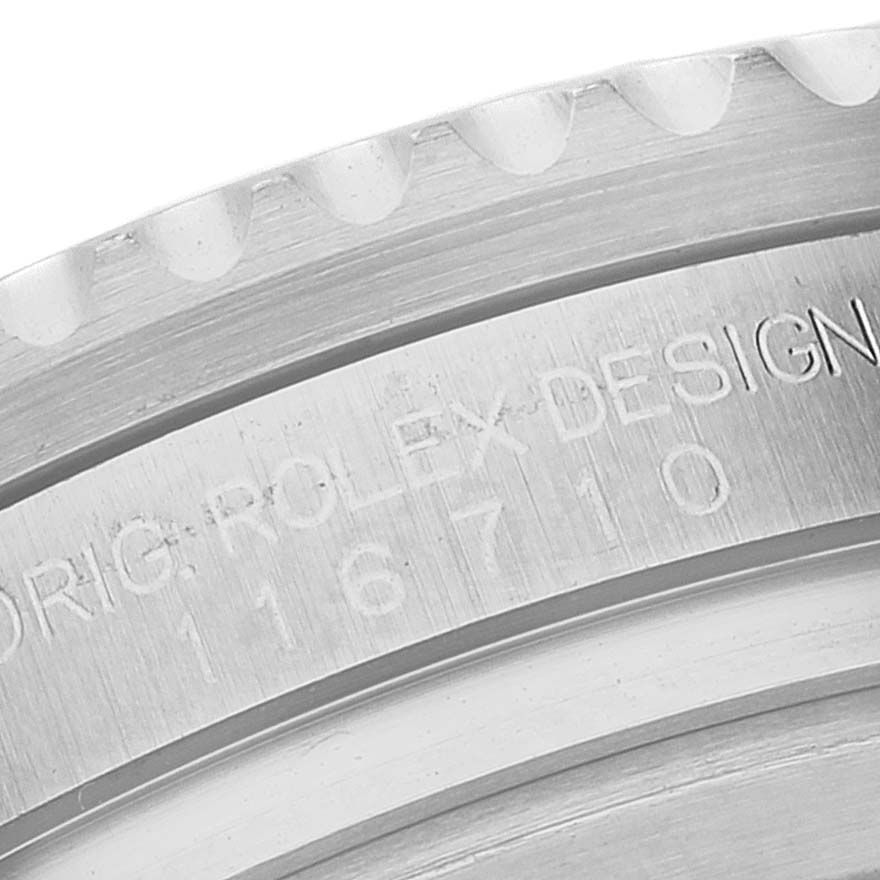 This image shows a close-up view of the engraved bezel side of a Rolex GMT-Master 116710 Men's Stainless Steel Black Dial 116710 Men's Stainless Steel Black Dial model watch, displaying the design and model number.