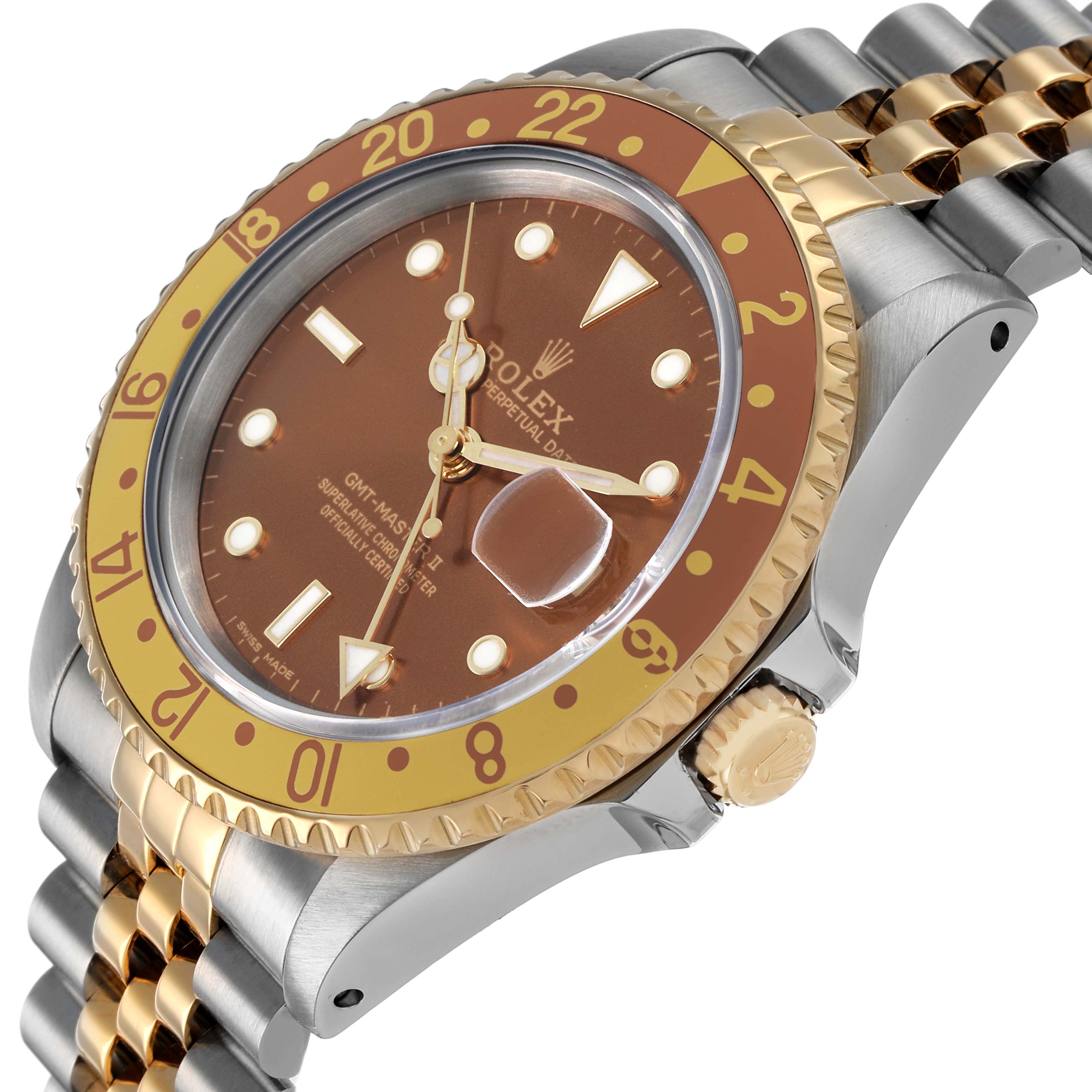 The image shows a Rolex GMT-Master 16713 Men's Steel and Gold (two tone) Brown Dial watch at an angle showcasing the bezel, dial, and part of the bracelet.
