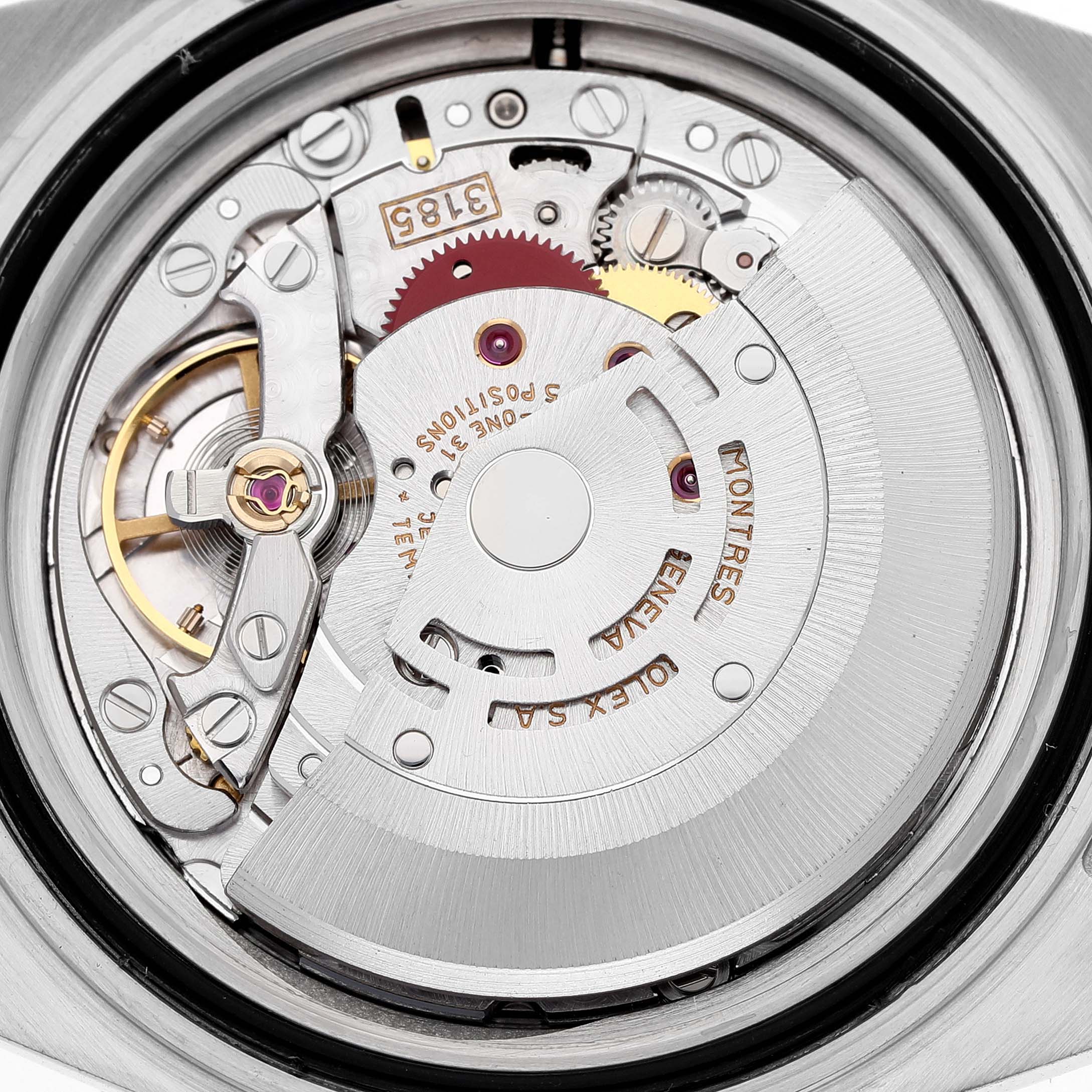 The image shows the movement of the Rolex GMT-Master 16713 Men's Steel and Gold (two tone) Brown Dial, featuring the rotor and gears from a top-down angle.