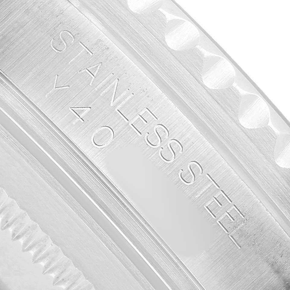 The image shows a close-up of the case side of a Rolex GMT-Master 16710 Men's Stainless Steel Black Dial displaying "STAINLESS STEEL".