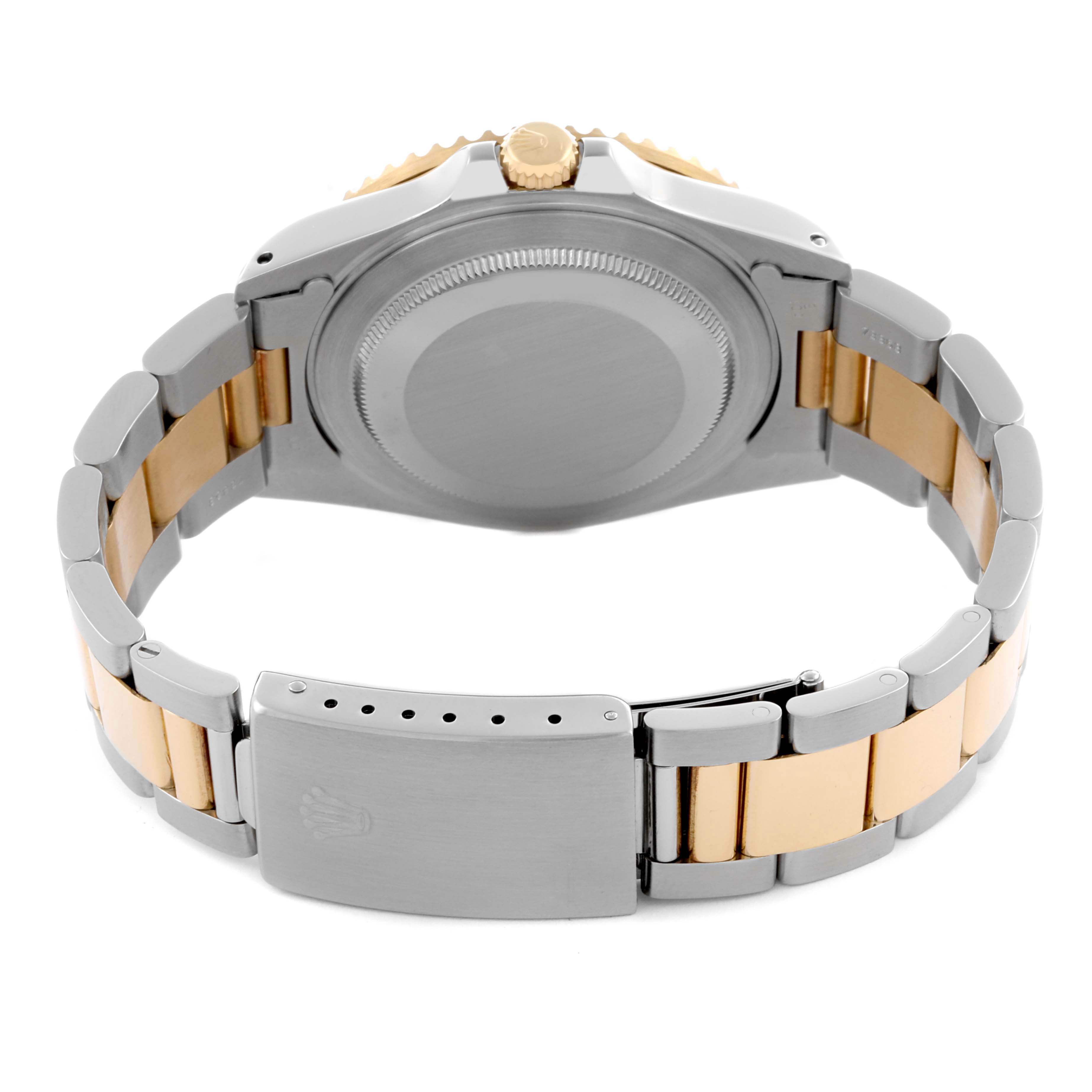 The image shows the back casing and closed clasp of a Rolex GMT-Master 16713 Men's Steel and Gold (two tone) Black Dial 16713 Men's Steel and Gold (two tone) Black Dial watch at a rear angle.