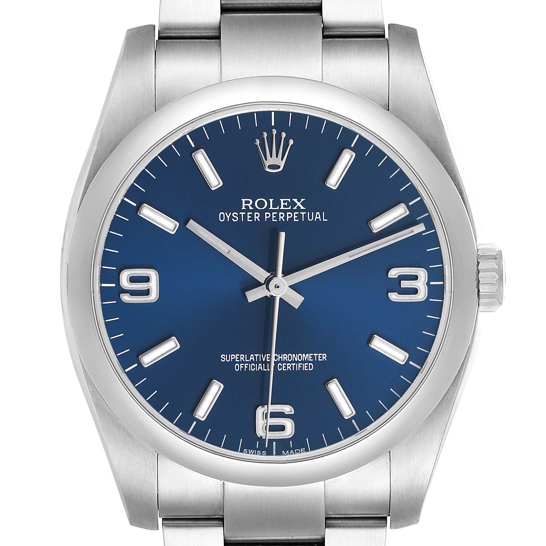 The Rolex Oyster Perpetual 116000 Men's Stainless Steel Blue Dial watch is shown from the front, displaying the blue dial, hands, markers, crown, and part of the bracelet.