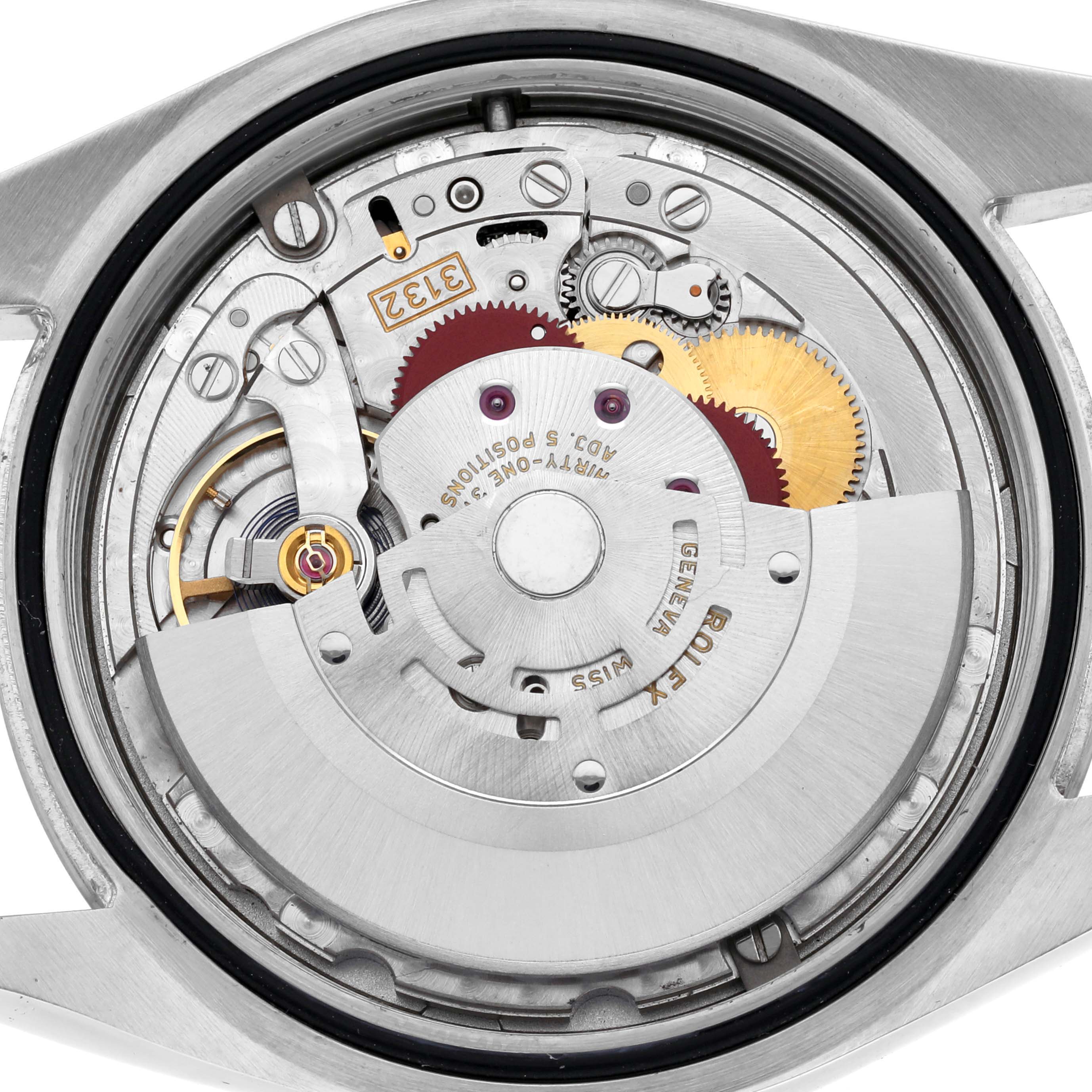 The image shows the internal movement of a Rolex Oyster Perpetual 114300 Men's Stainless Steel Grey Dial 114300 Men's Stainless Steel Grey Dial watch, viewed from the back.