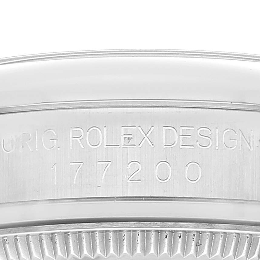 This image shows a close-up of the case back and model number engraving on a Mid-Size Rolex watch.