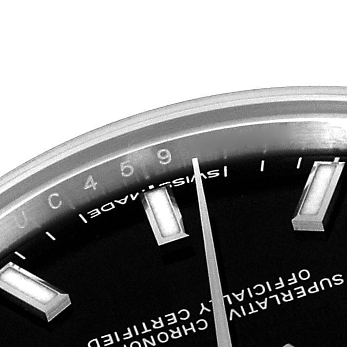 The image shows a close-up of the dial, hour markers, and second hand of a Rolex Mid-Size 177200 Women
s Stainless Steel Black Dial 177200 Women
s Stainless Steel Black Dial model watch.