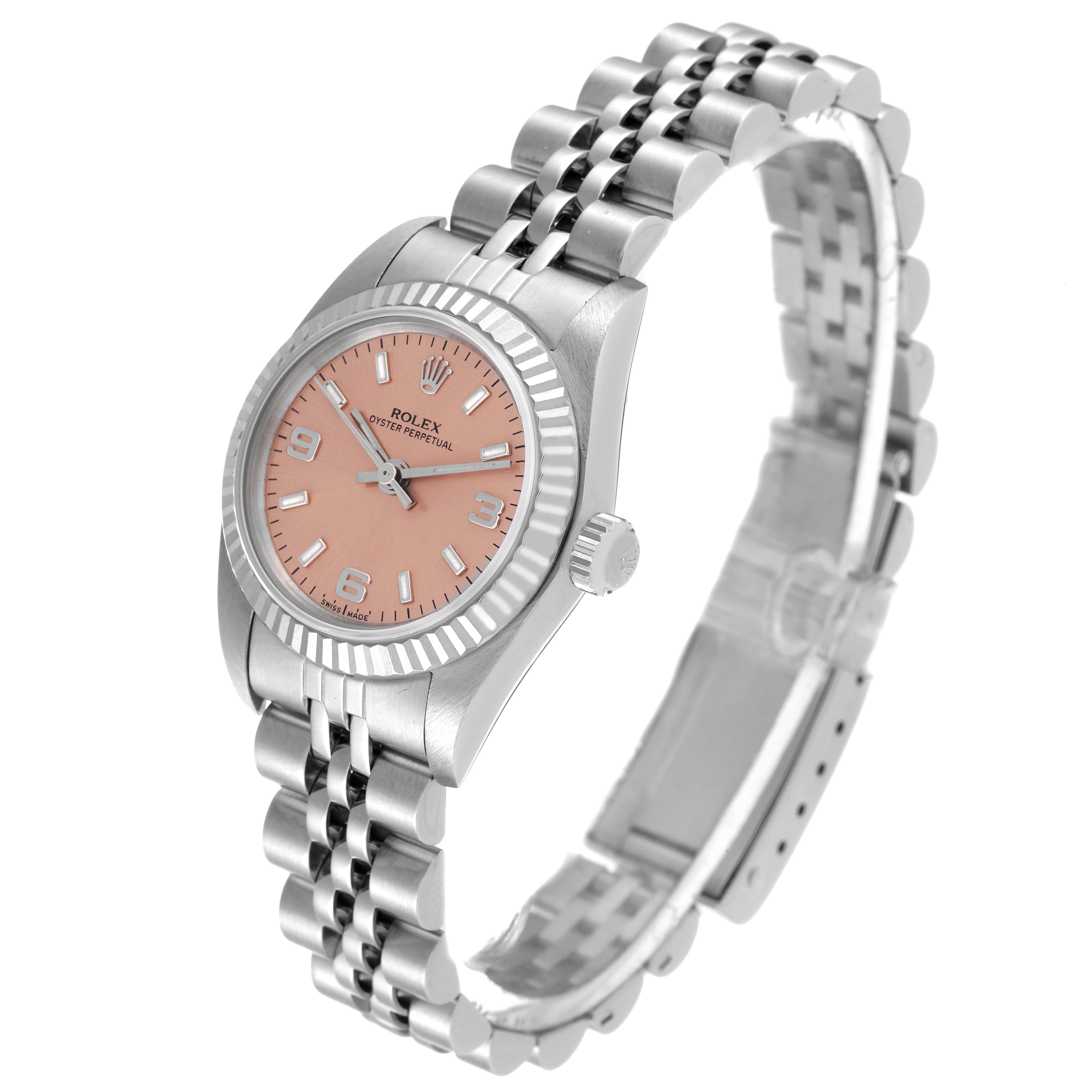 The image shows a Rolex Oyster Perpetual 76094 Women
s Stainless Steel Pink Dial 76094 Women
s Stainless Steel Pink Dial watch at a three-quarter angle, highlighting the face, bezel, crown, and bracelet.