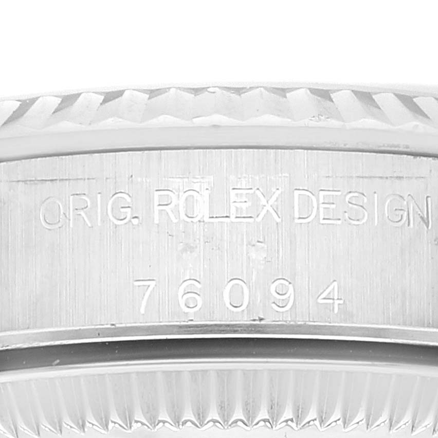 This image shows a close-up of the engraved serial number and branding on the side of the Oyster Perpetual Rolex watch casing.