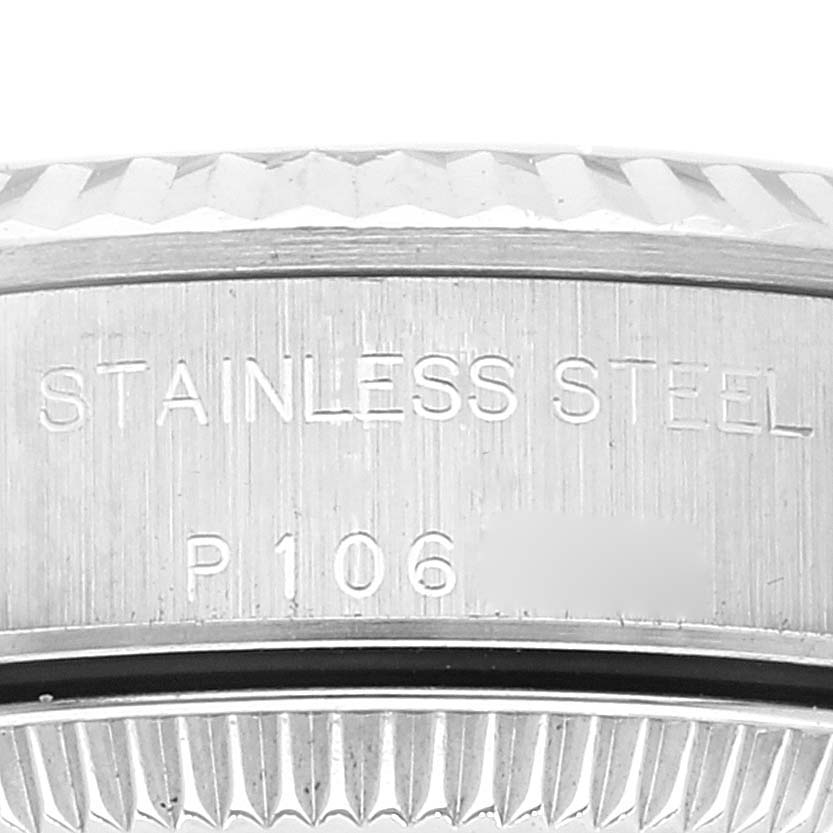 The image shows a close-up of the side of a stainless steel Oyster Perpetual Rolex watch case with part of the model number visible.