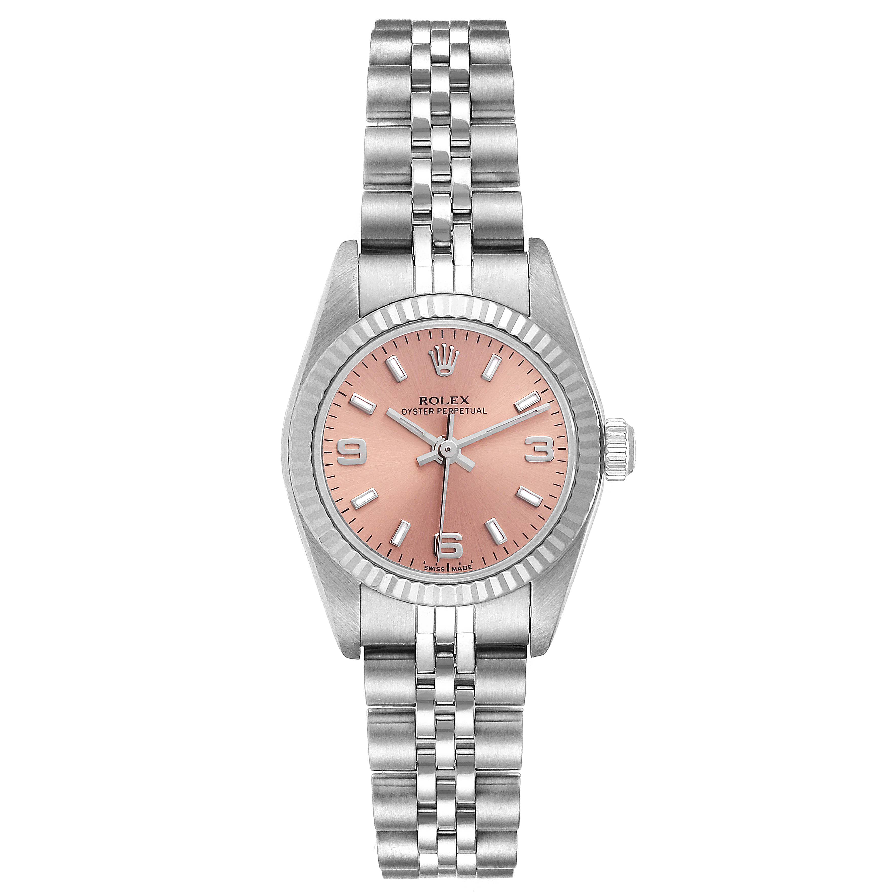 The image shows a Rolex Oyster Perpetual 76094 Women
s Stainless Steel Pink Dial 76094 Women
s Stainless Steel Pink Dial watch from a top-down angle, highlighting its whole face and bracelet.