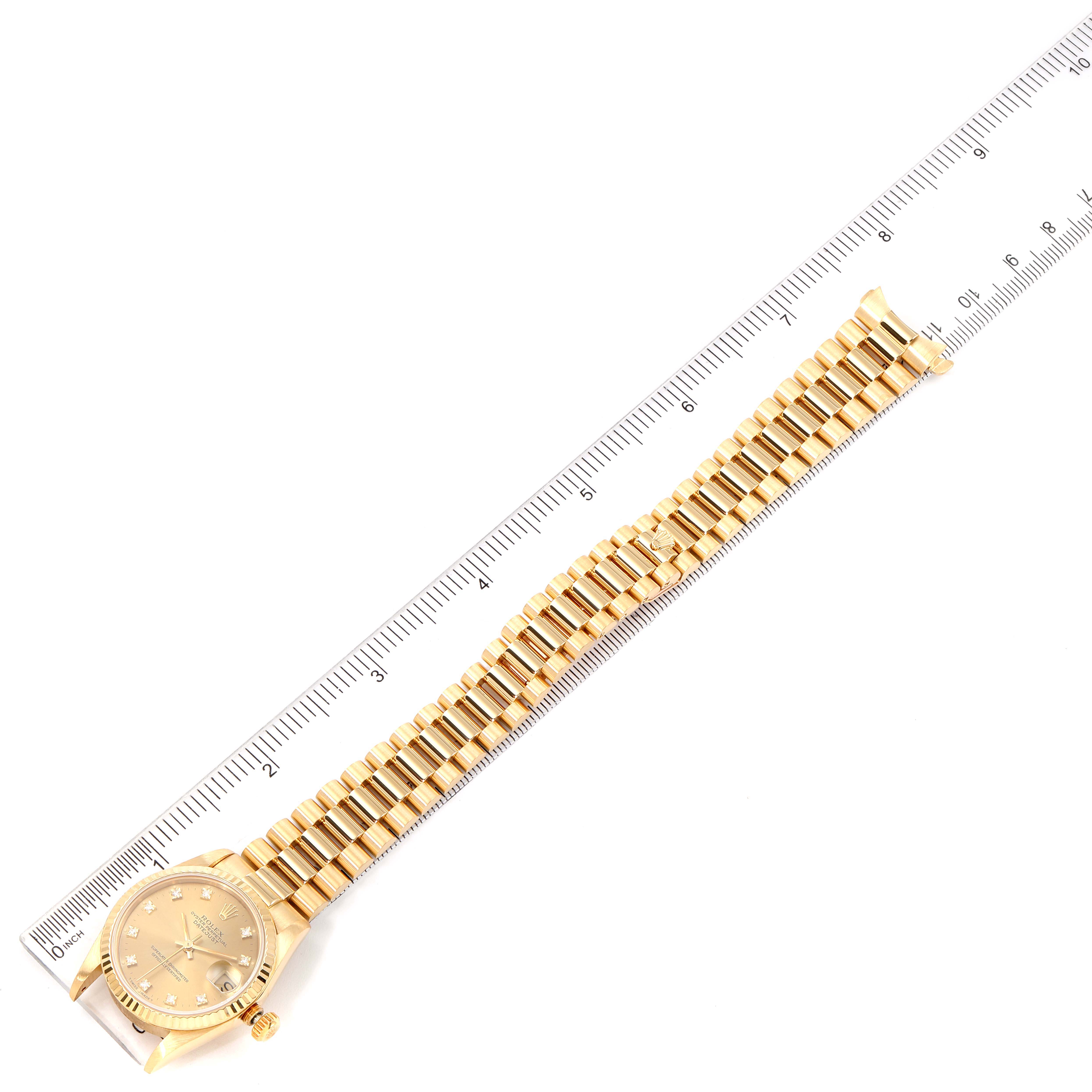 The image shows a Rolex President 68278 Women
s Yellow Gold Champagne Dial 68278 Women
s Yellow Gold Champagne Dial model watch lying flat, measured with a ruler.