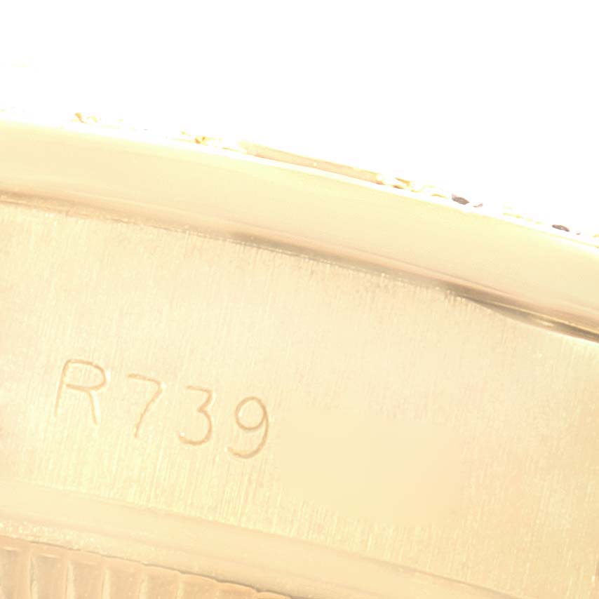 This image shows a close-up angle of the side of the case with engraved markings on a Rolex President 69068 Women
s Yellow Gold Champagne Dial 69068 Women
s Yellow Gold Champagne Dial model watch.