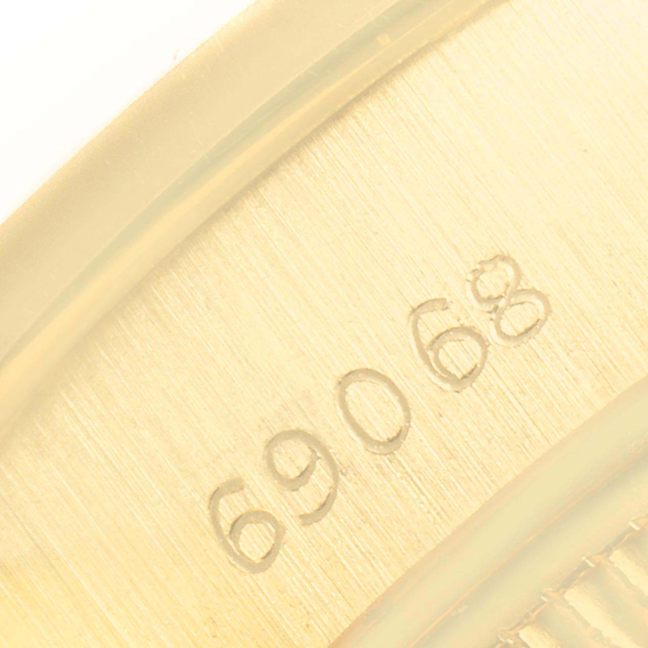 The image shows a close-up of the model number "69068" on the Rolex President 69068 Women
s Yellow Gold Champagne Dial 69068 Women
s Yellow Gold Champagne Dial watch.