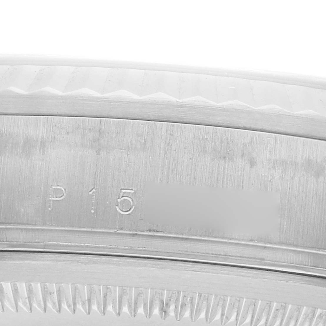 The image shows a close-up of the case edge and rehaut of a Rolex President 118239 Men's White Gold Silver Dial model watch, focusing on its engravings.
