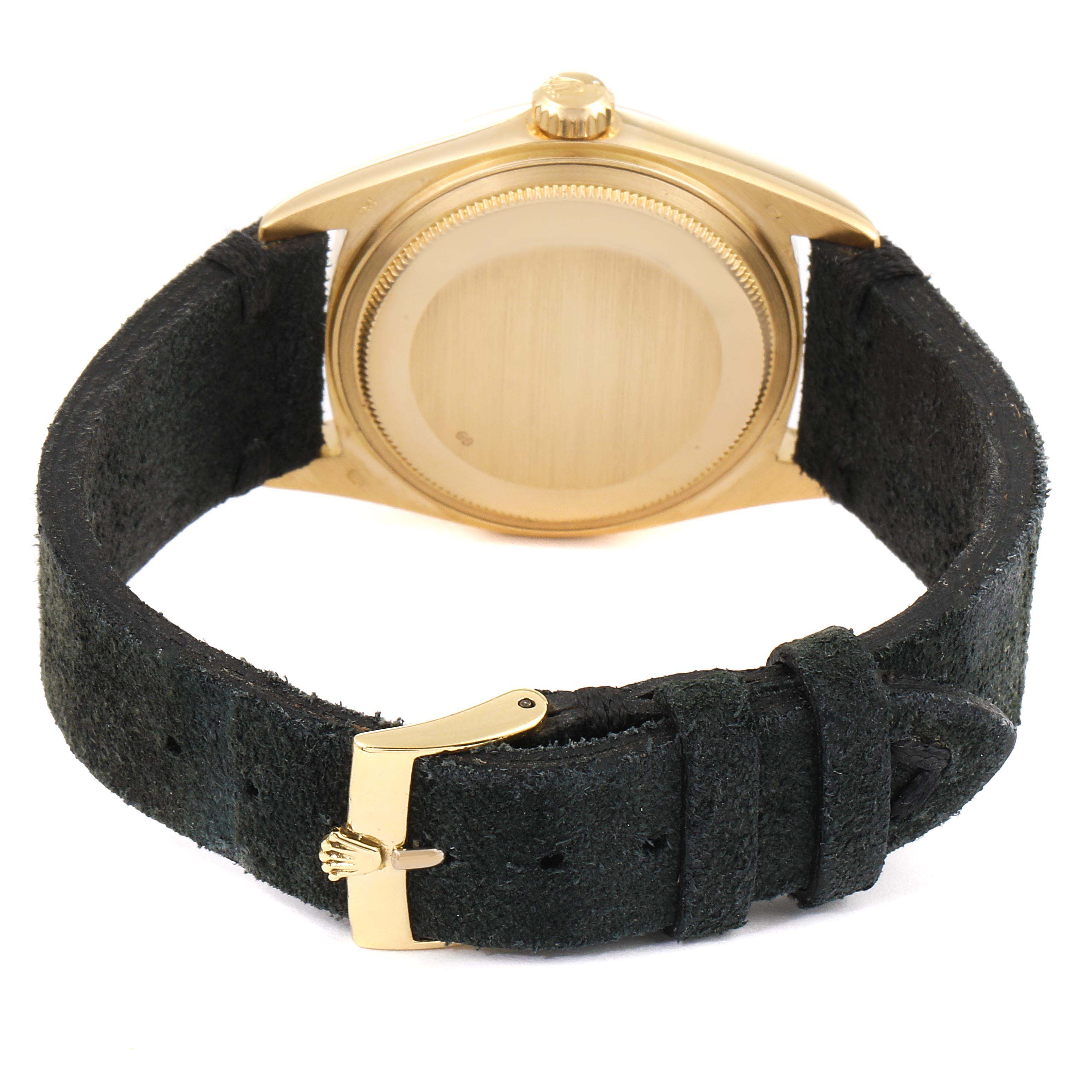 The image shows the back view of a Rolex Vintage Collection 1803 Men's Yellow Gold Champagne Dial 1803 Men's Yellow Gold Champagne Dial watch, highlighting its black strap and gold buckle.