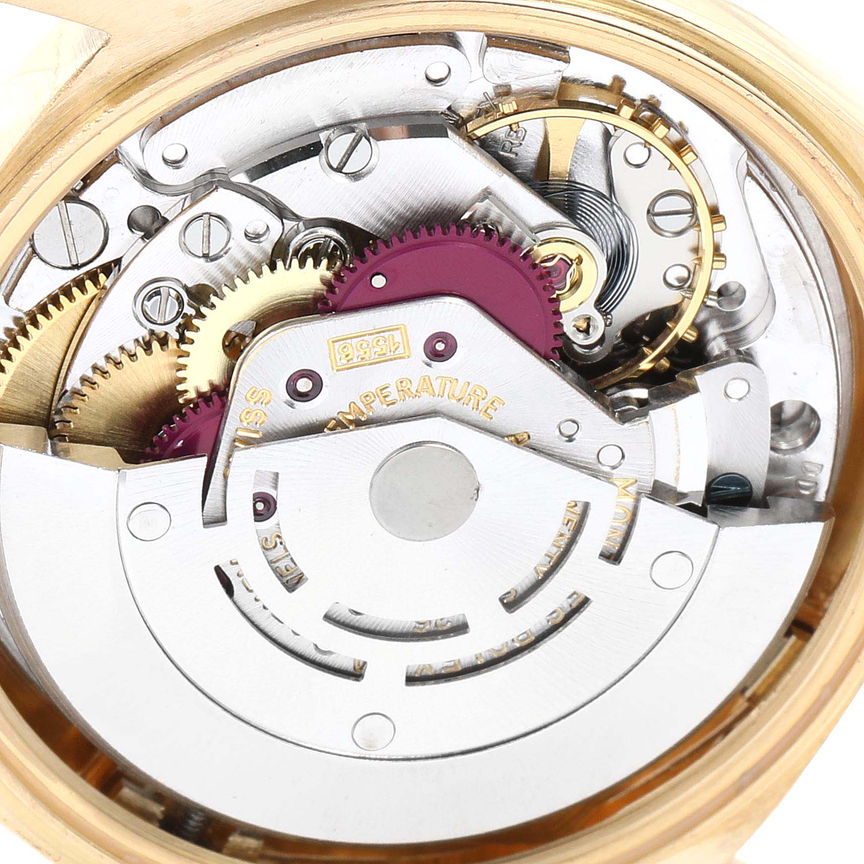 This image shows the intricate internal mechanics of the Rolex Vintage Collection 1803 Men's Yellow Gold Champagne Dial 1803 Men's Yellow Gold Champagne Dial watch at a close-up angle.