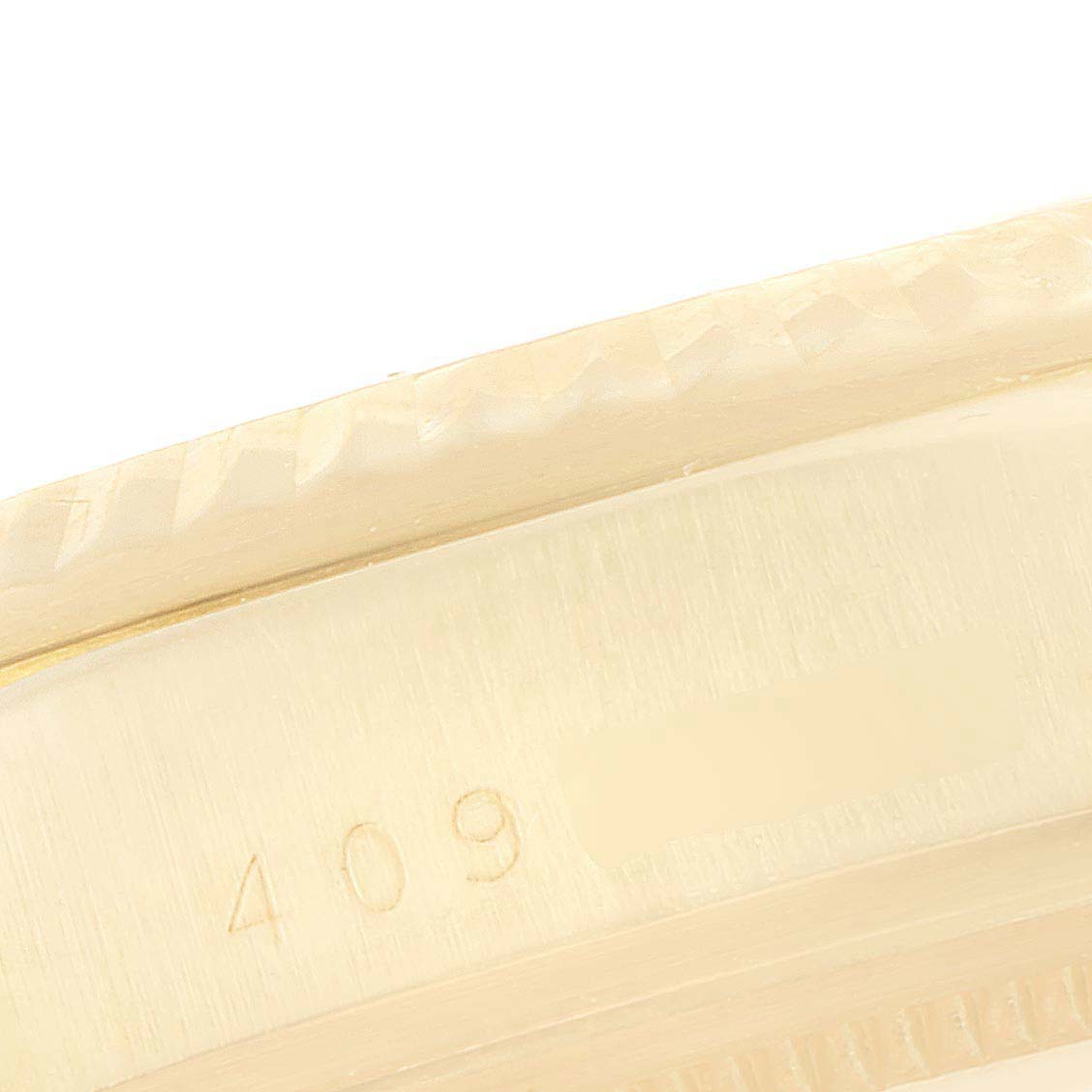 This image shows a close-up of the side edge and part of the bezel of the Vintage Collection model by Rolex.