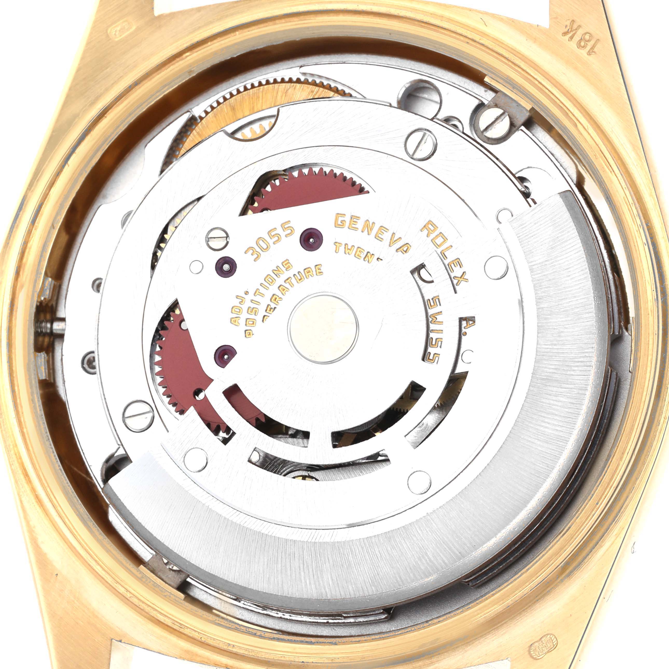 The image shows the internal mechanism of the Rolex President 18038 Men's Yellow Gold Champagne Dial 18038 Men's Yellow Gold Champagne Dial watch, displaying gears and engravings from a top-down angle.