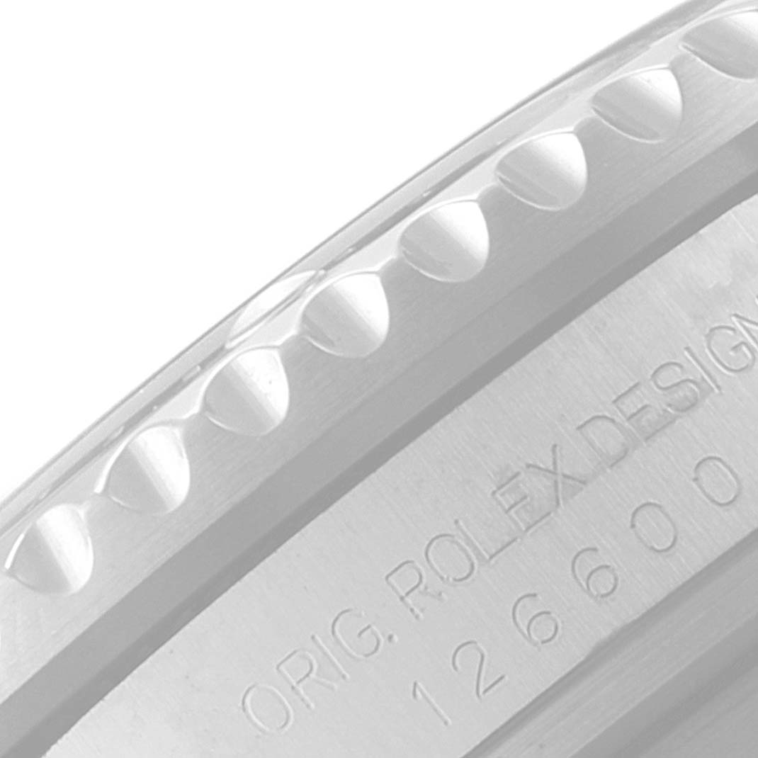 This close-up image shows the side view of the bezel and engravings on the case of the Rolex Sea-Dweller 126600 Men
s Stainless Steel Black Dial 126600 Men
s Stainless Steel Black Dial watch.